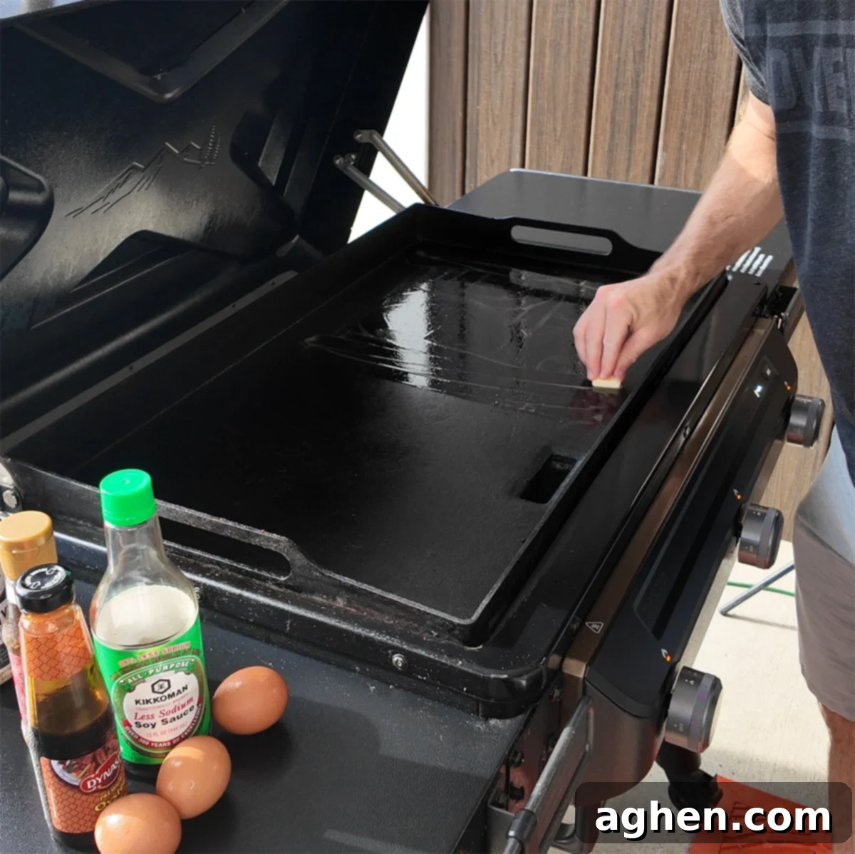 Preheating the Traeger Flatrock griddle with butter melting on its surface.