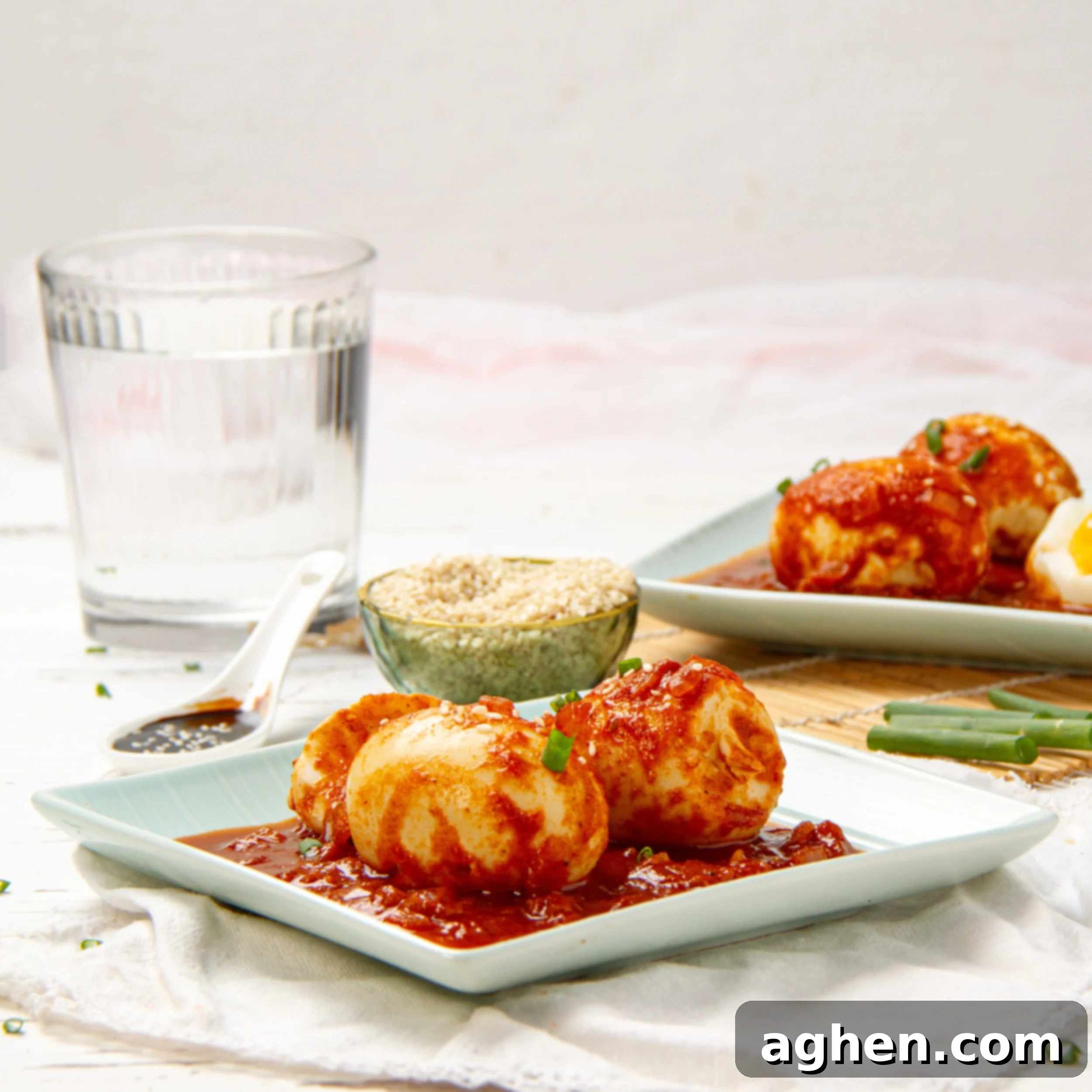 TikTok viral Egg Boils in tomato sauce on a small plate, ready to be enjoyed.