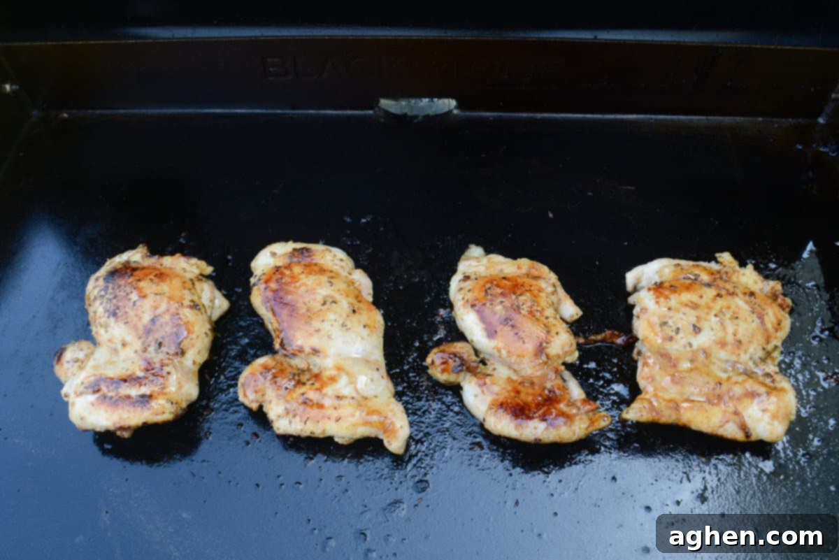 The Blackstone Guide to a Merry Christmas 9 Recipes 4 chicken thighs cooking on blackstone