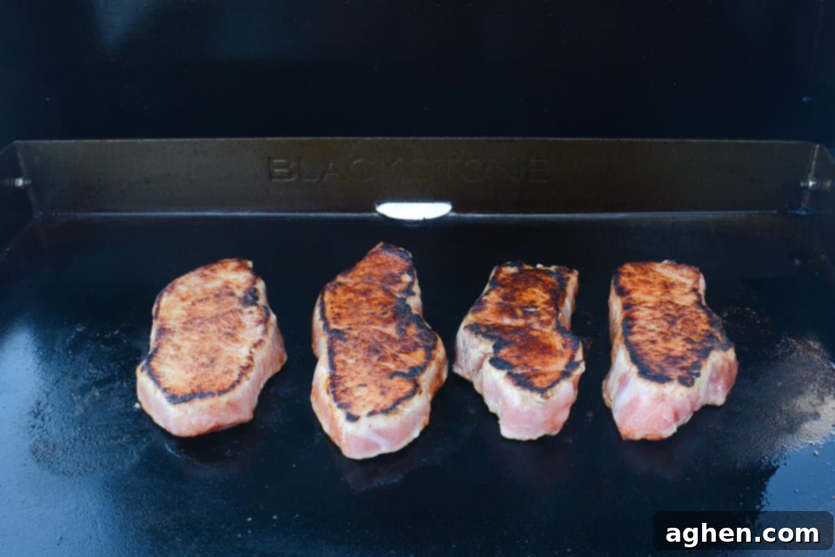 The Blackstone Guide to a Merry Christmas 9 Recipes 6 porkchops cooking on blackstone