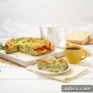 Cheesy Broccoli Breakfast Casserole 7 A slice of broccoli cheese breakfast egg bake on a plate with the remaining portion on cutting board in the background.