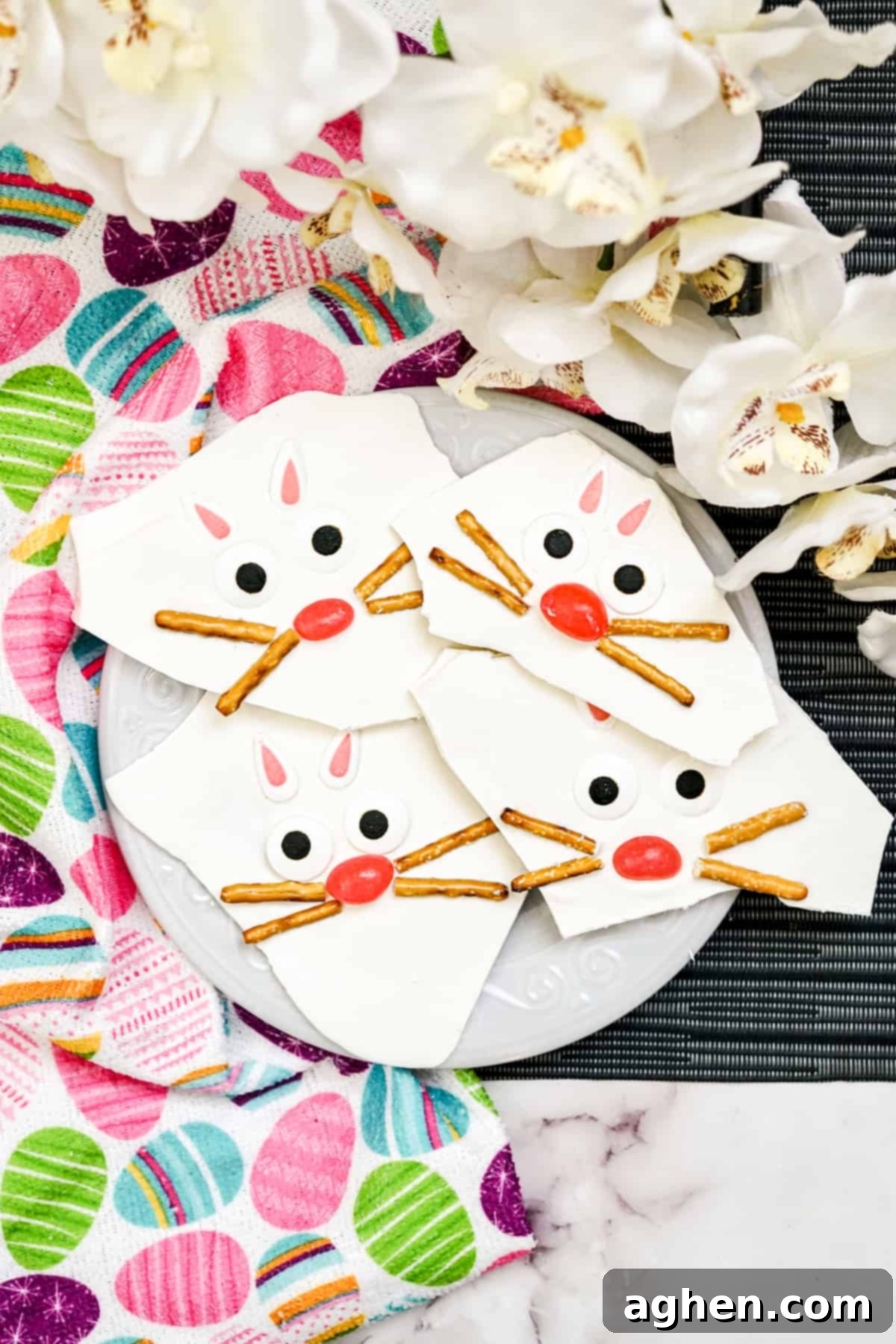 Easter Bunny Bark with pretzels, jelly beans, candy eyes, and candy ears, arranged on a tray, showcasing the adorable bunny faces.