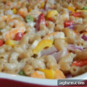 A beautiful, vibrant photo of the Shrimp Alfredo Pasta Casserole, showcasing its creamy texture and fresh ingredients.