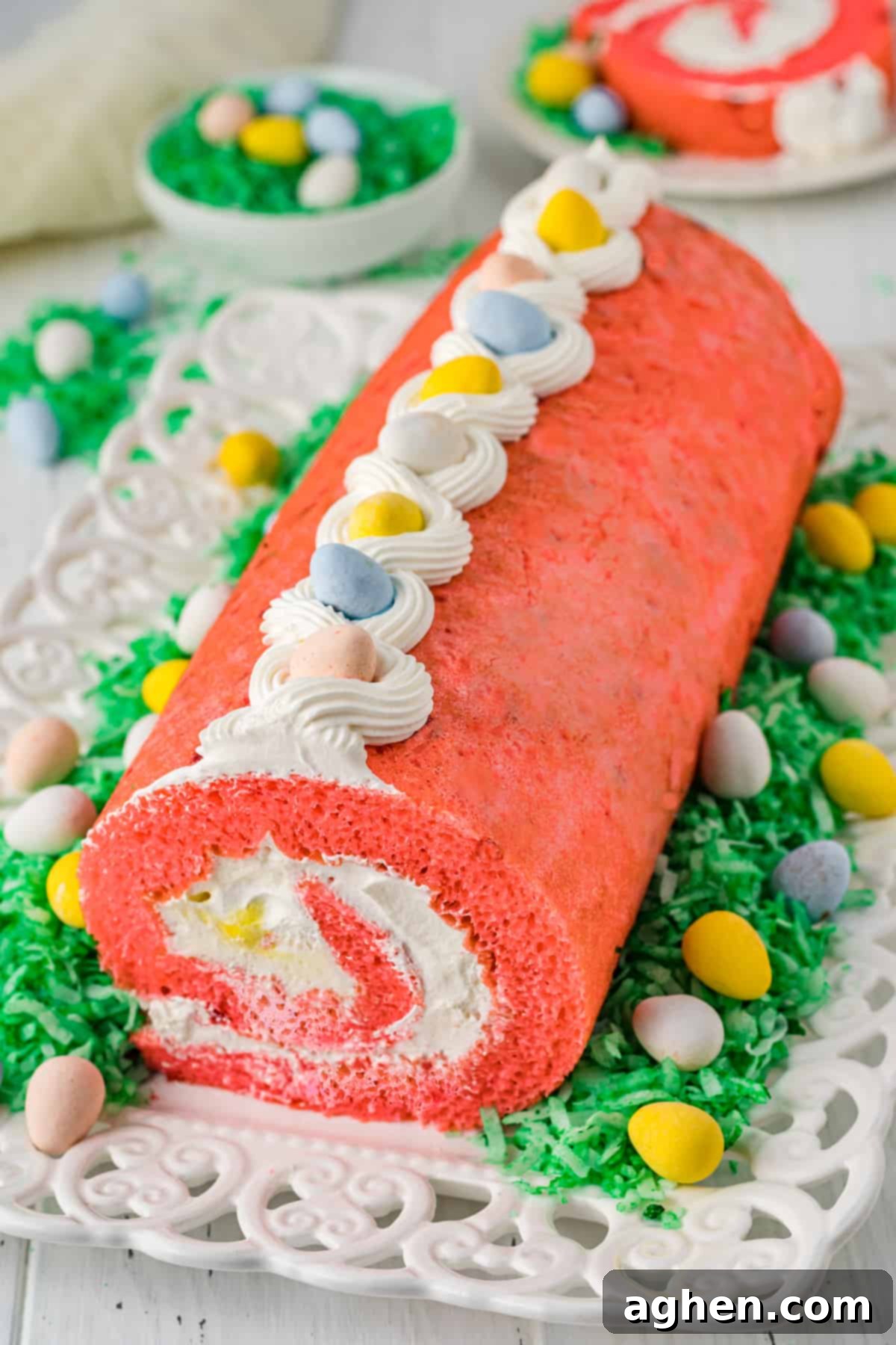 Easter strawberry cake roll with whipped cream filling and cadbury mini eggs.