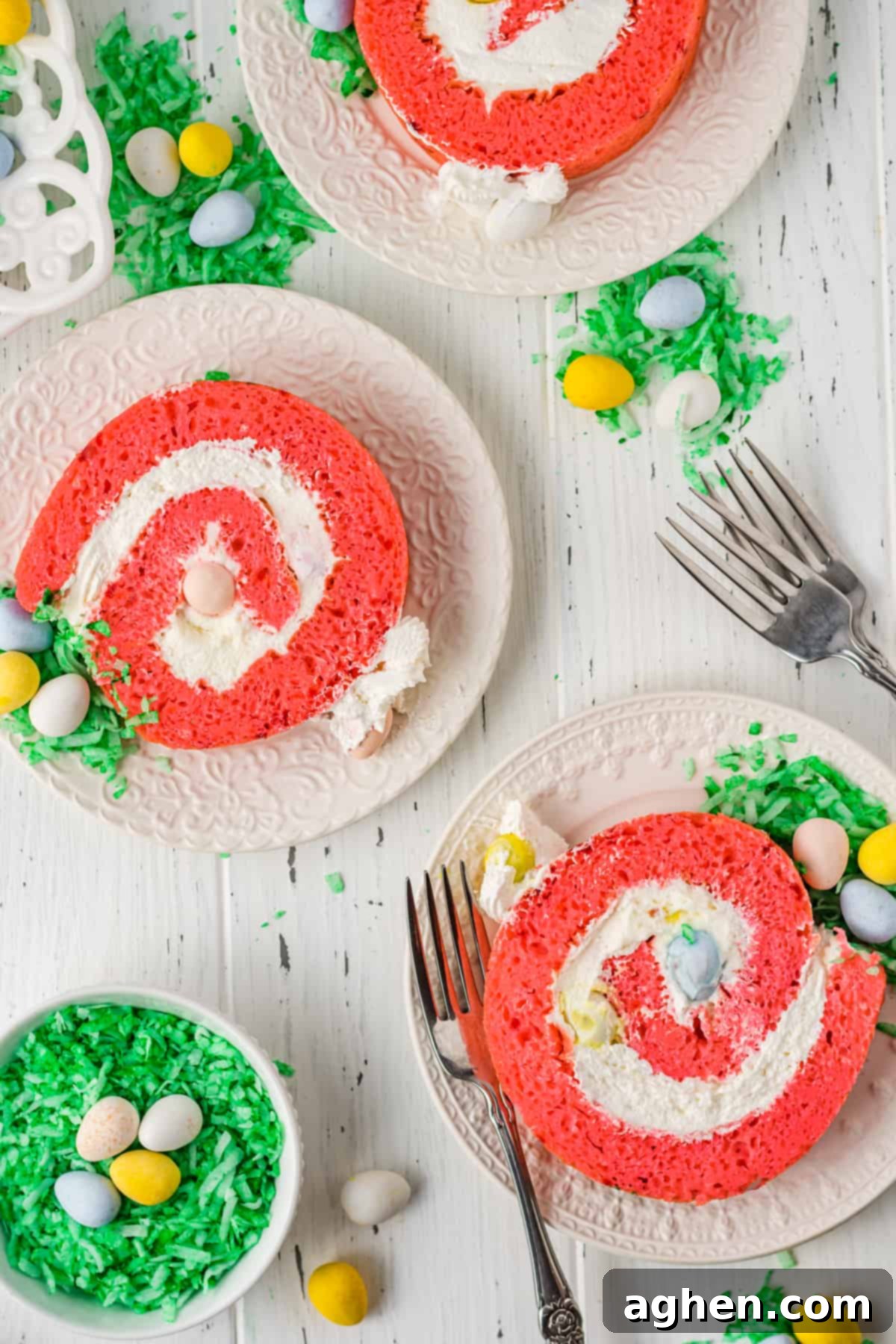 Plated slices of easter egg roll cake with cadbury mini eggs.