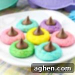 Colorful Easter Blossom Cookies with Hershey Kisses on white plate.