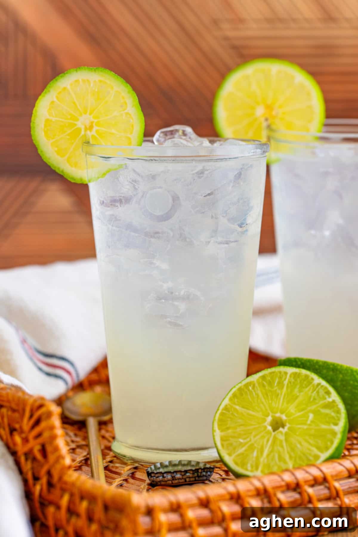 Two Ranch Water Cocktails in tall glasses with lime wheels, ready to be served and enjoyed.