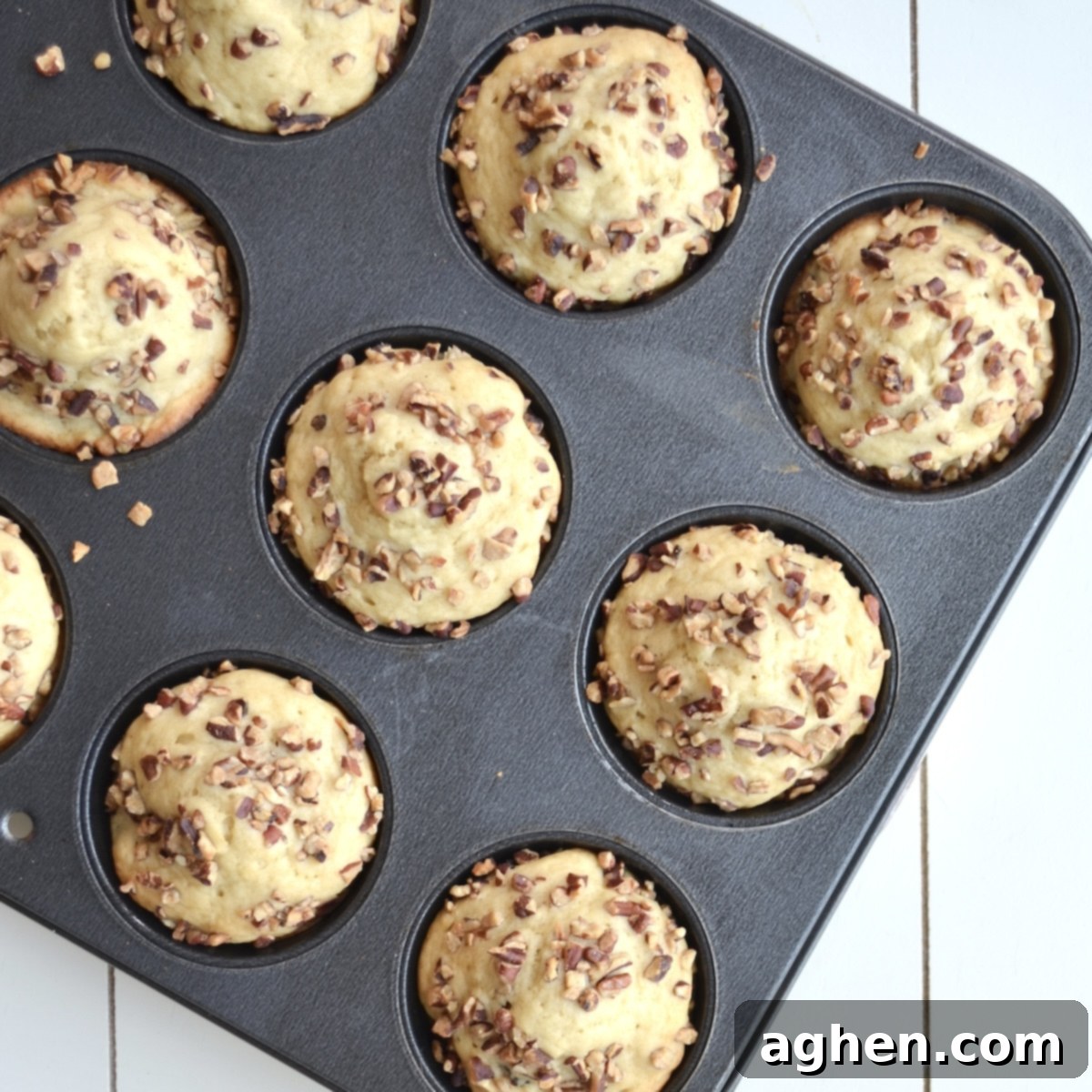 Guilt-Free Cranberry Pecan Muffins 5 Freshly baked cranberry pecan muffins with crunchy topping