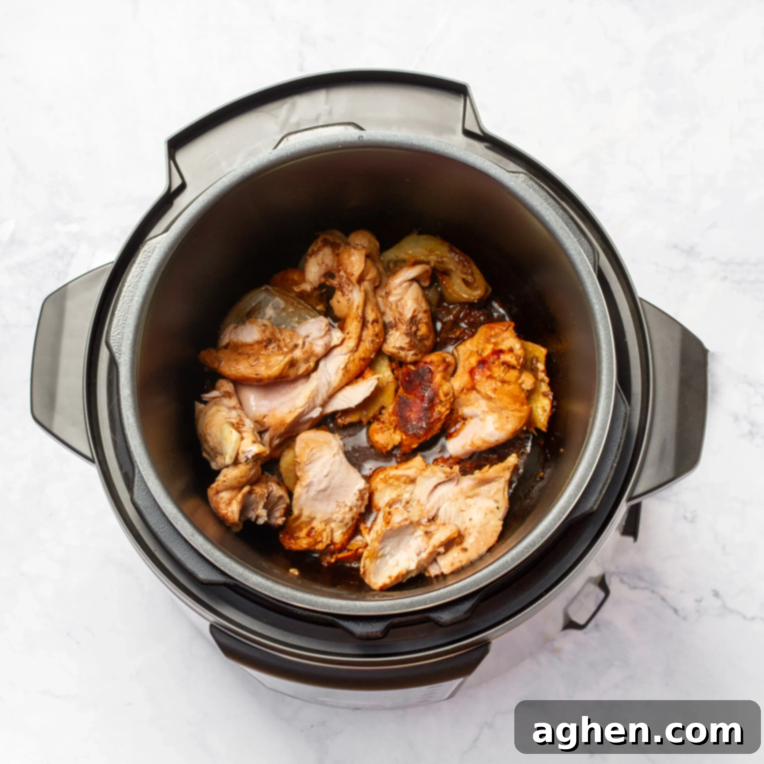 Perfectly cooked, tender chicken breasts inside the Instant Pot after pressure cooking.