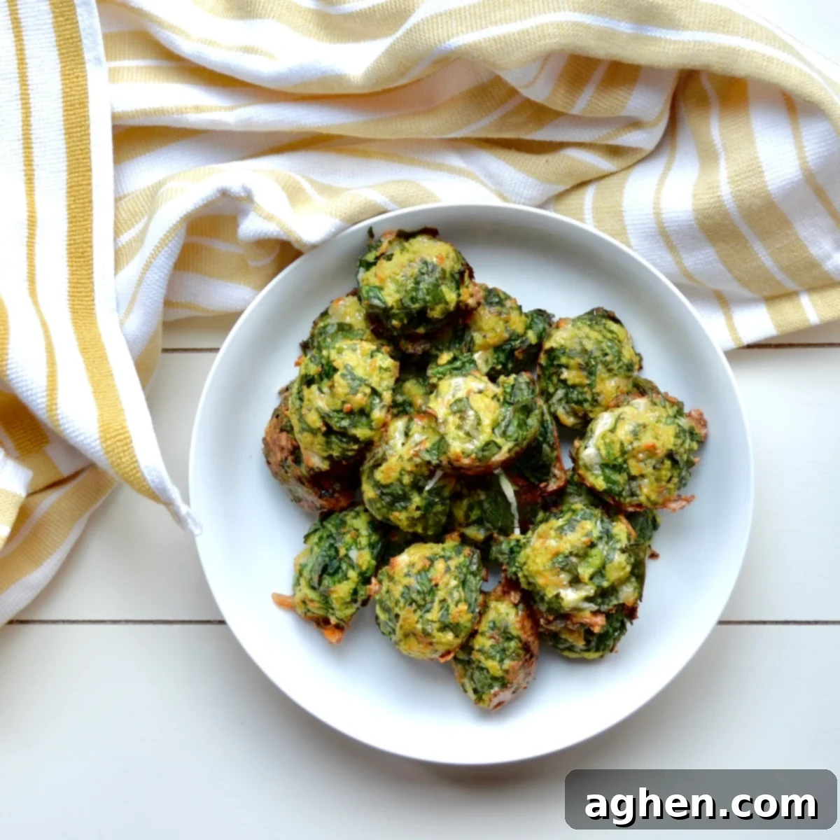 A bowl of freshly baked Weight Watchers spinach balls, perfectly golden and ready to serve