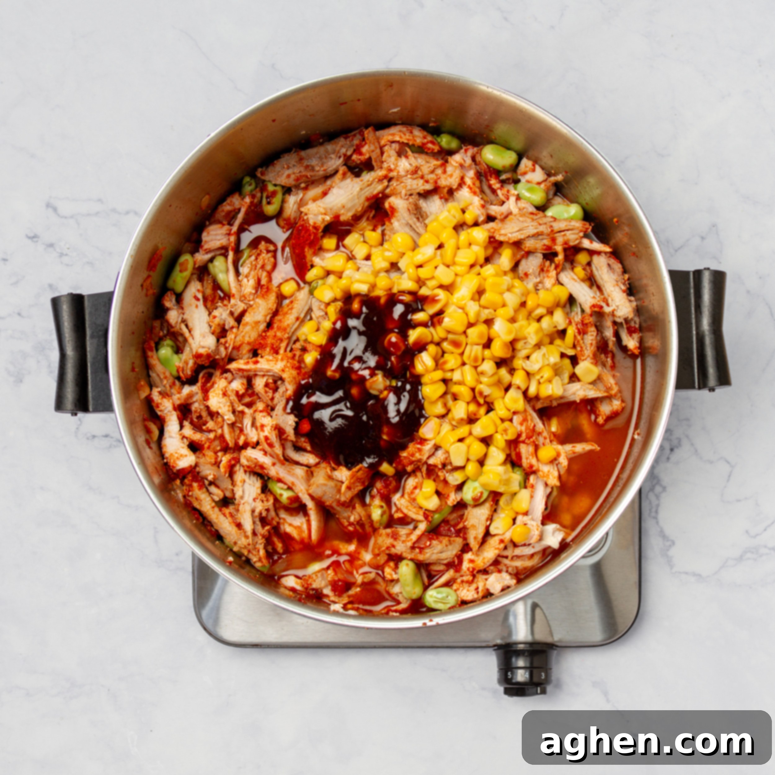 Brunswick Stew: Delicious and Weight Watchers Approved 6 All the Brunswick Stew ingredients, including broth, barbecue sauce, corn, and spices, combined in a large pot and ready to simmer.