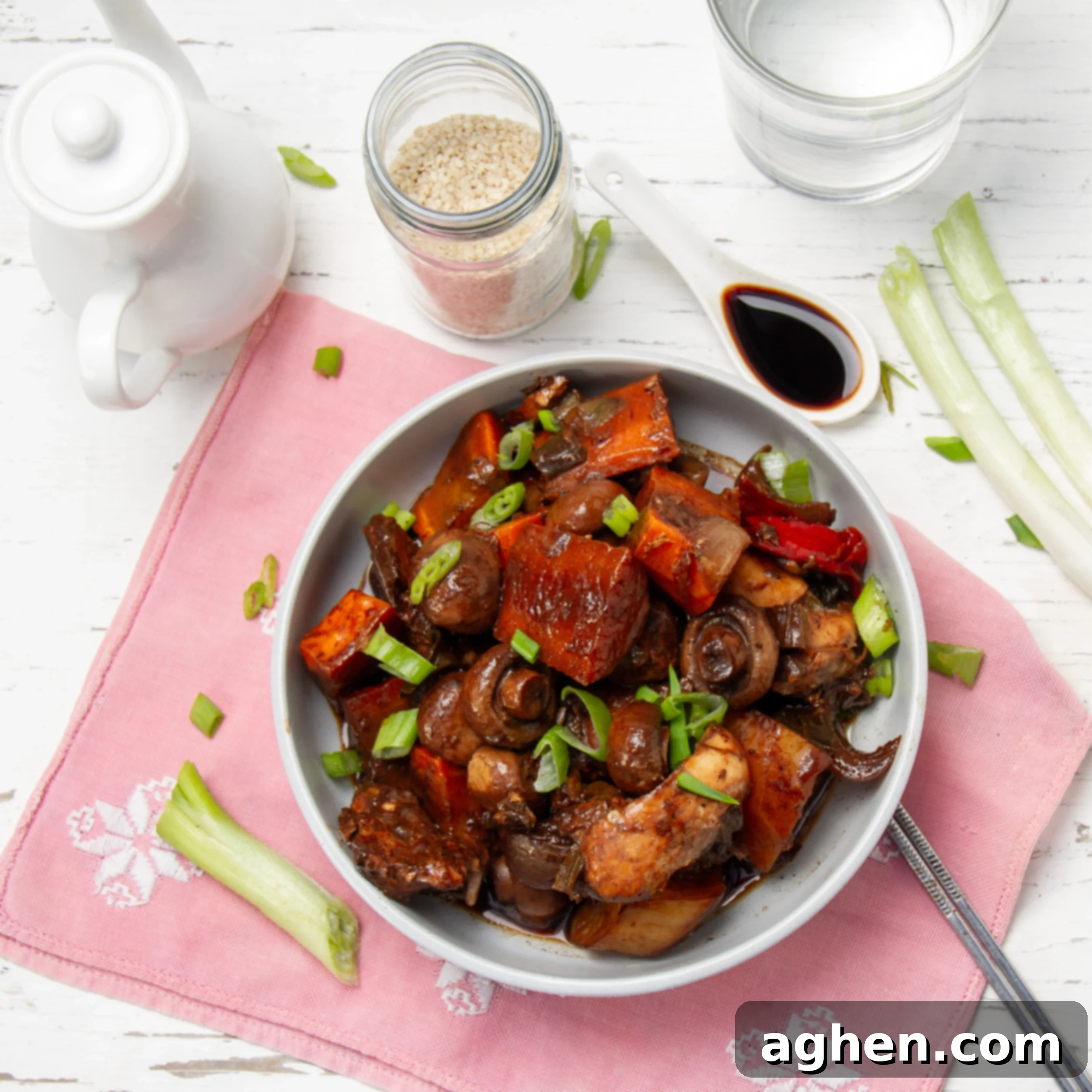 Tender and flavorful Korean Braised Chicken made in the slow cooker, garnished with green onions.