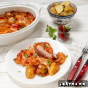 Spicy one pan piri-piri chicken on a plate with potatoes.