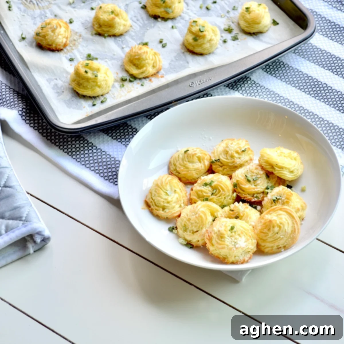 Guilt-Free Weight Watchers Duchess Potatoes 2 A bowl filled with golden-brown, elegantly piped WW Duchess Potatoes, ready to be served as a sophisticated side dish.