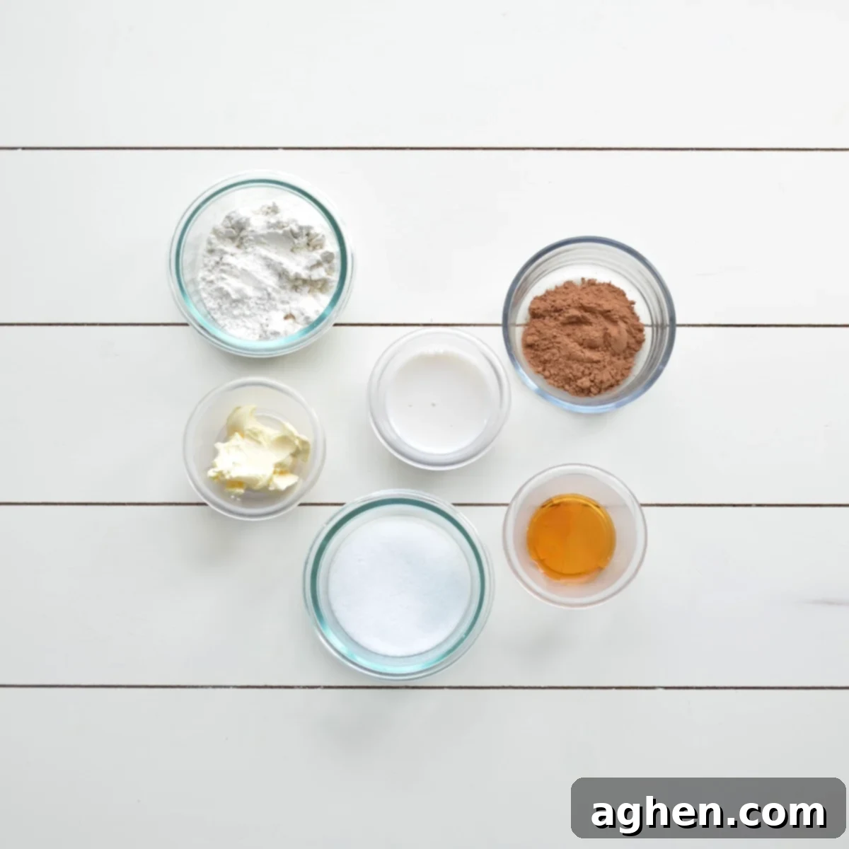 Guilt-Free Brownie Mug Bliss 3 Ingredients laid out for a brownie mug cake, including flour, cocoa, sugar substitute, butter substitute, and almond milk