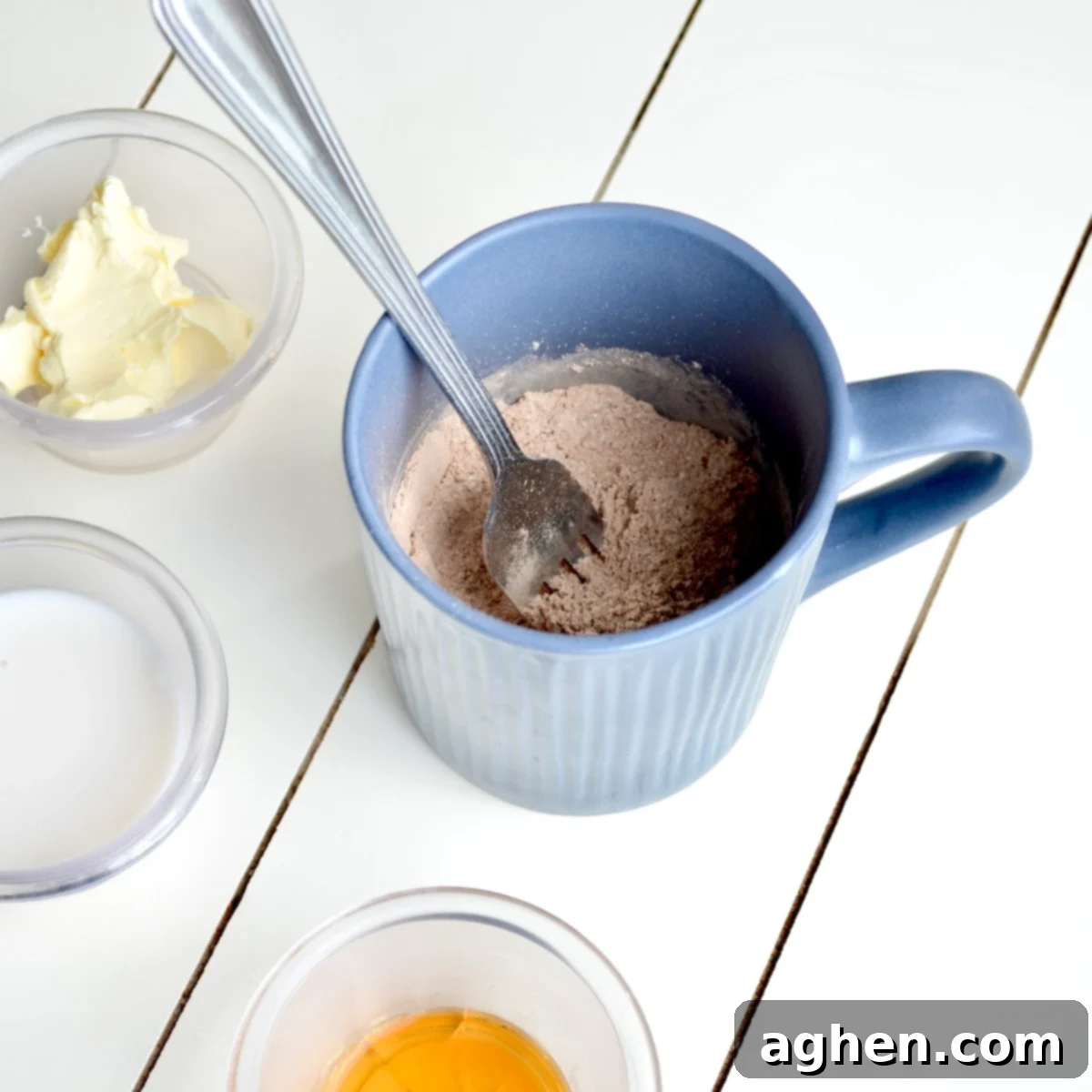 Guilt-Free Brownie Mug Bliss 4 A fork mixing dry ingredients in a mug for a brownie mug cake