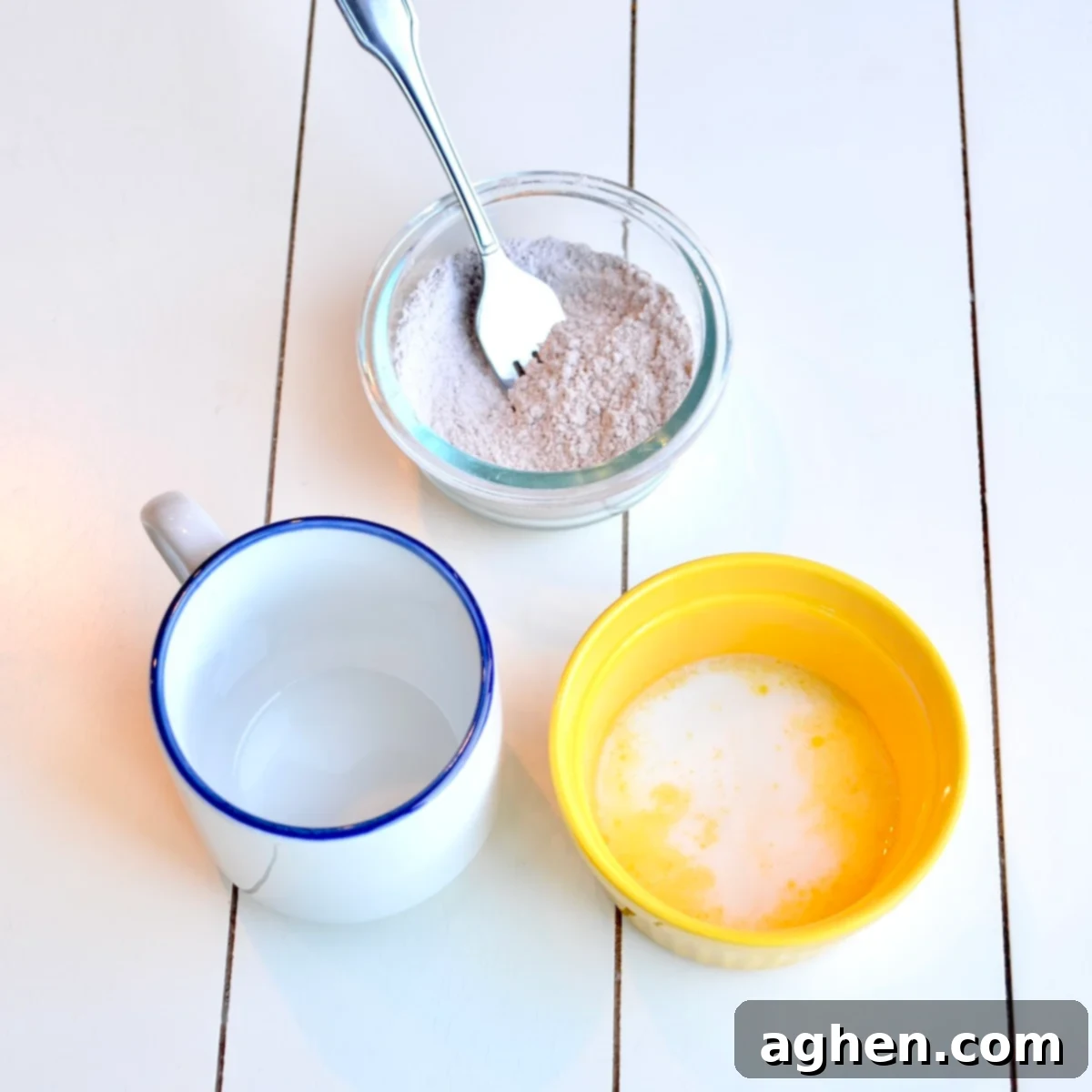 Close-up shot of the cake batter being mixed in a bowl for the hot chocolate mug cake.