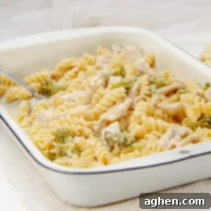 Creamy garlic parmesan chicken pasta in a baking dish, ready to serve.