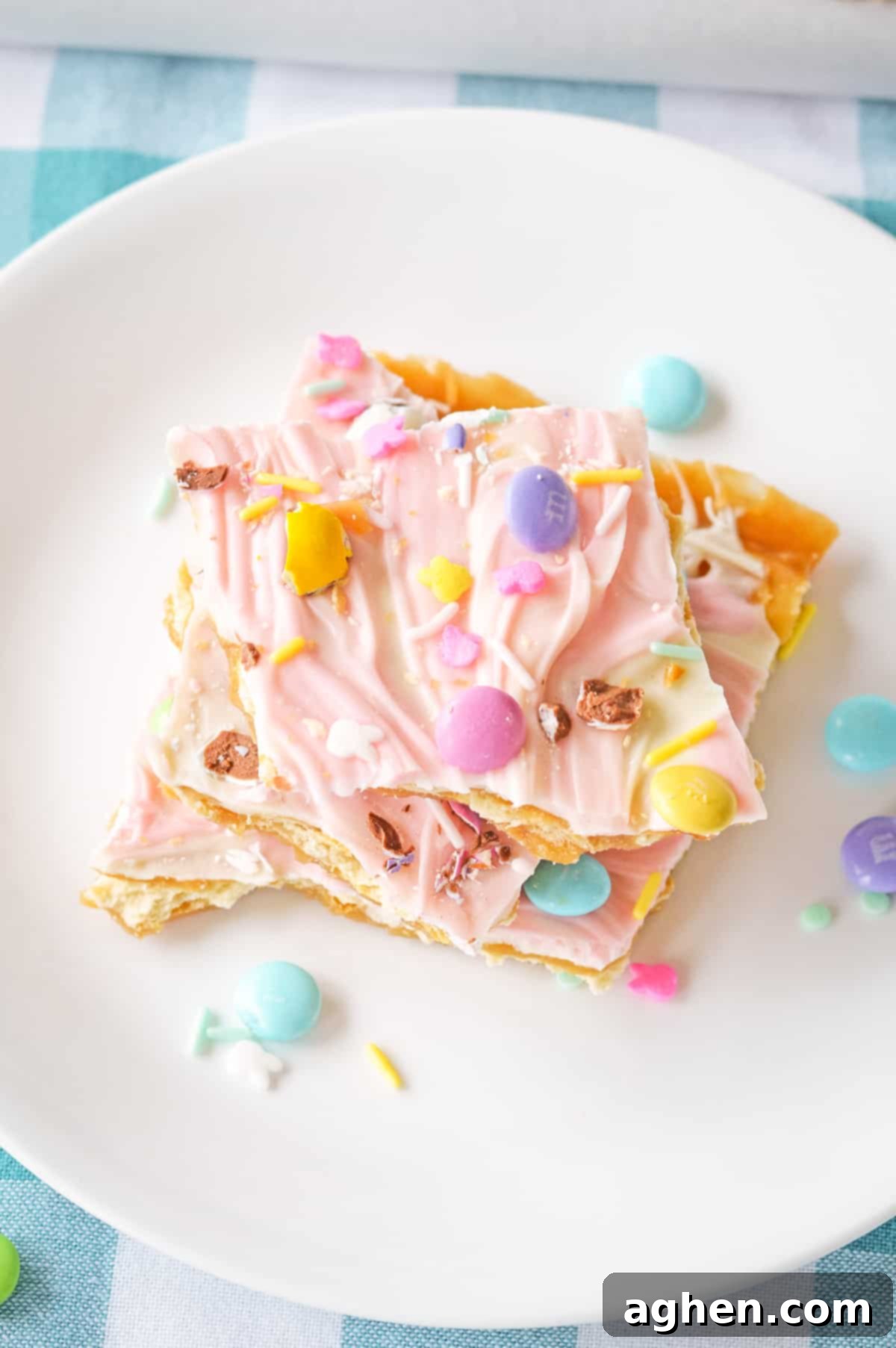 Easter crack candy made with saltines, white chocolate, pink food coloring, and easter candies.