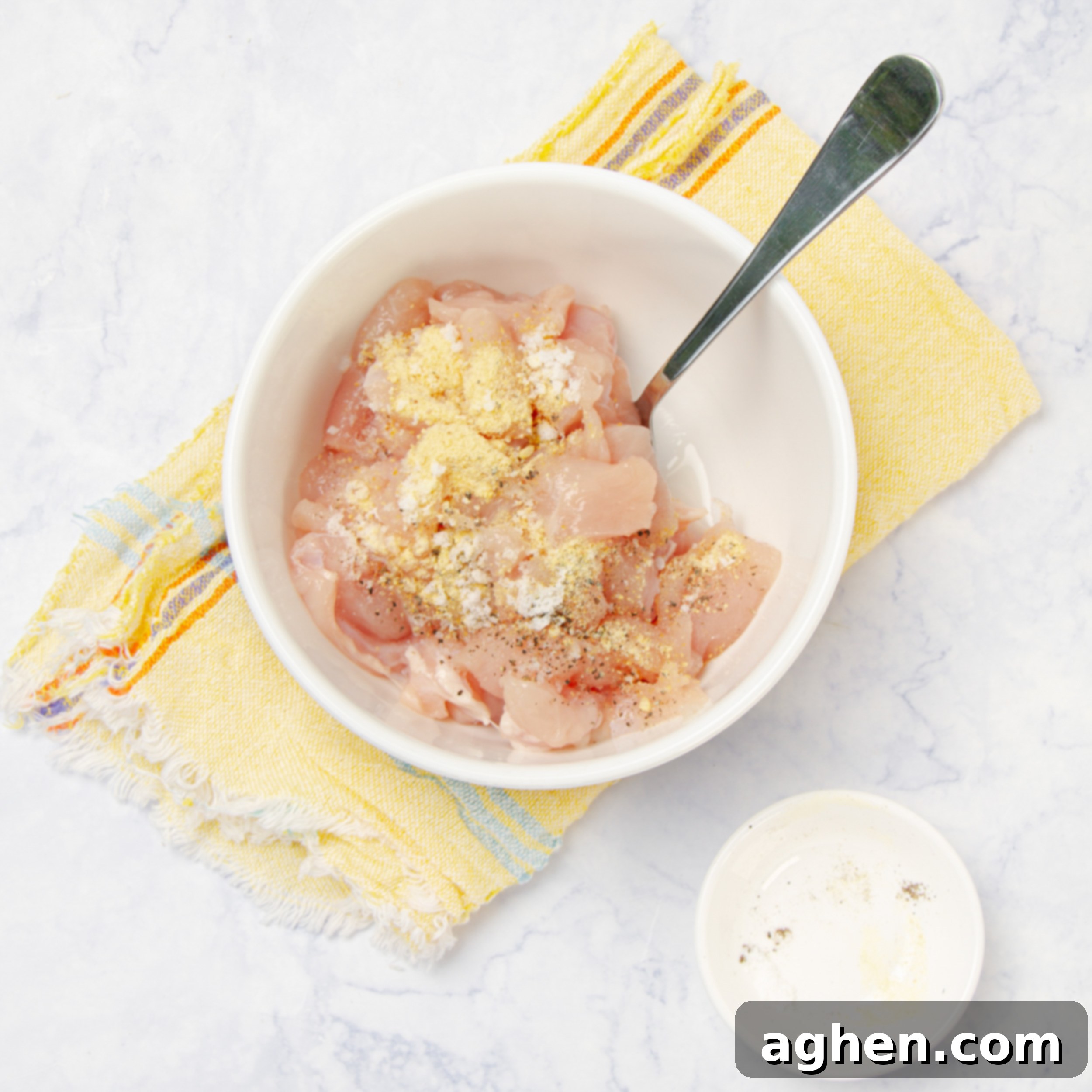 Angel Chicken Pasta: A Cherished Family Legacy 4 Chicken mixed with seasonings in a small bowl.