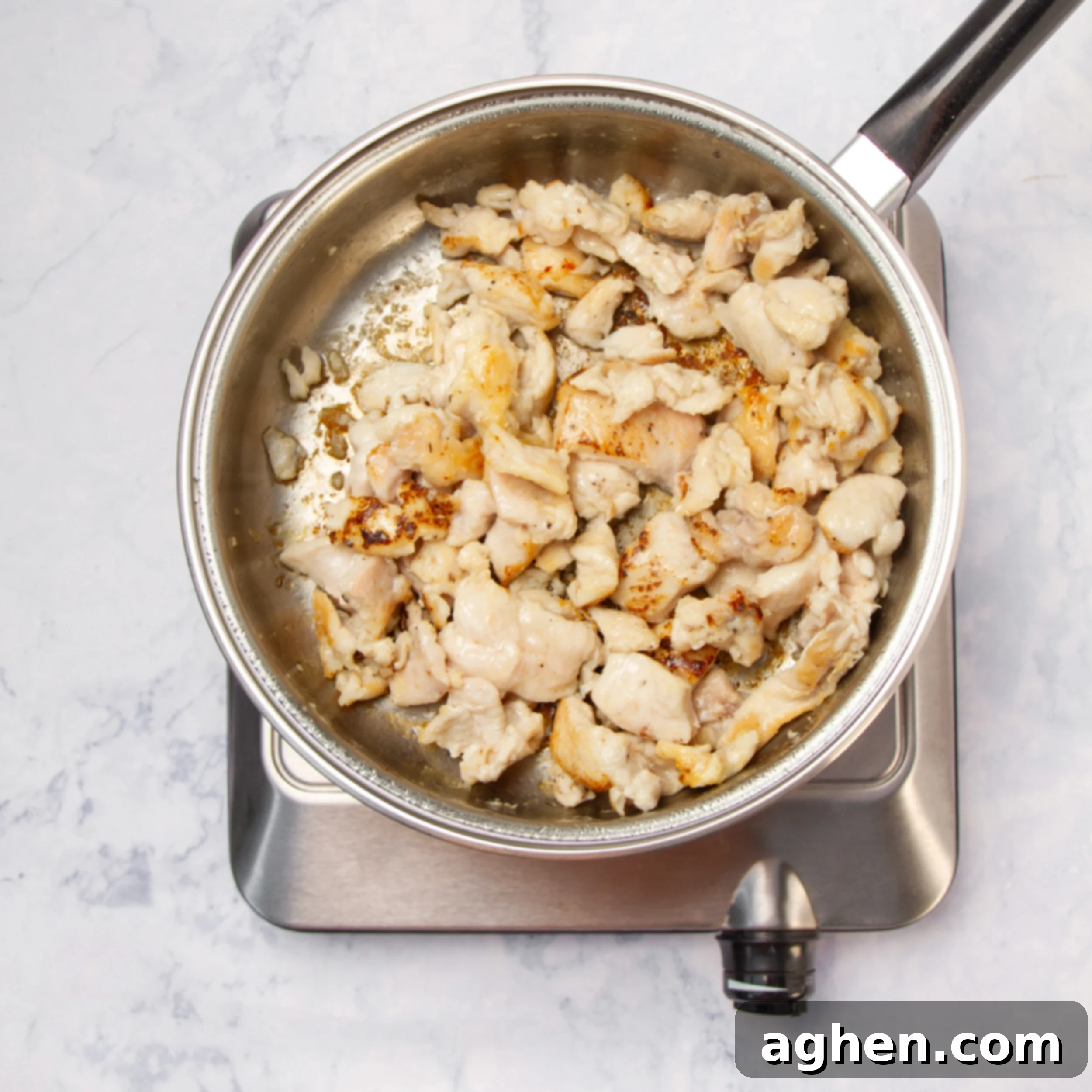 Angel Chicken Pasta: A Cherished Family Legacy 6 Chicken cooking in a hot pan.