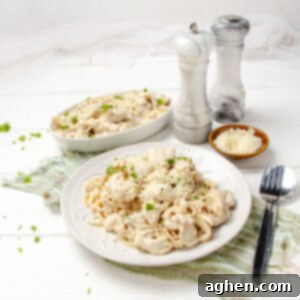 Angel Chicken Pasta: A Cherished Family Legacy 8 Creamy Angel Chicken Pasta on a plate with salt and pepper shakers on the side.