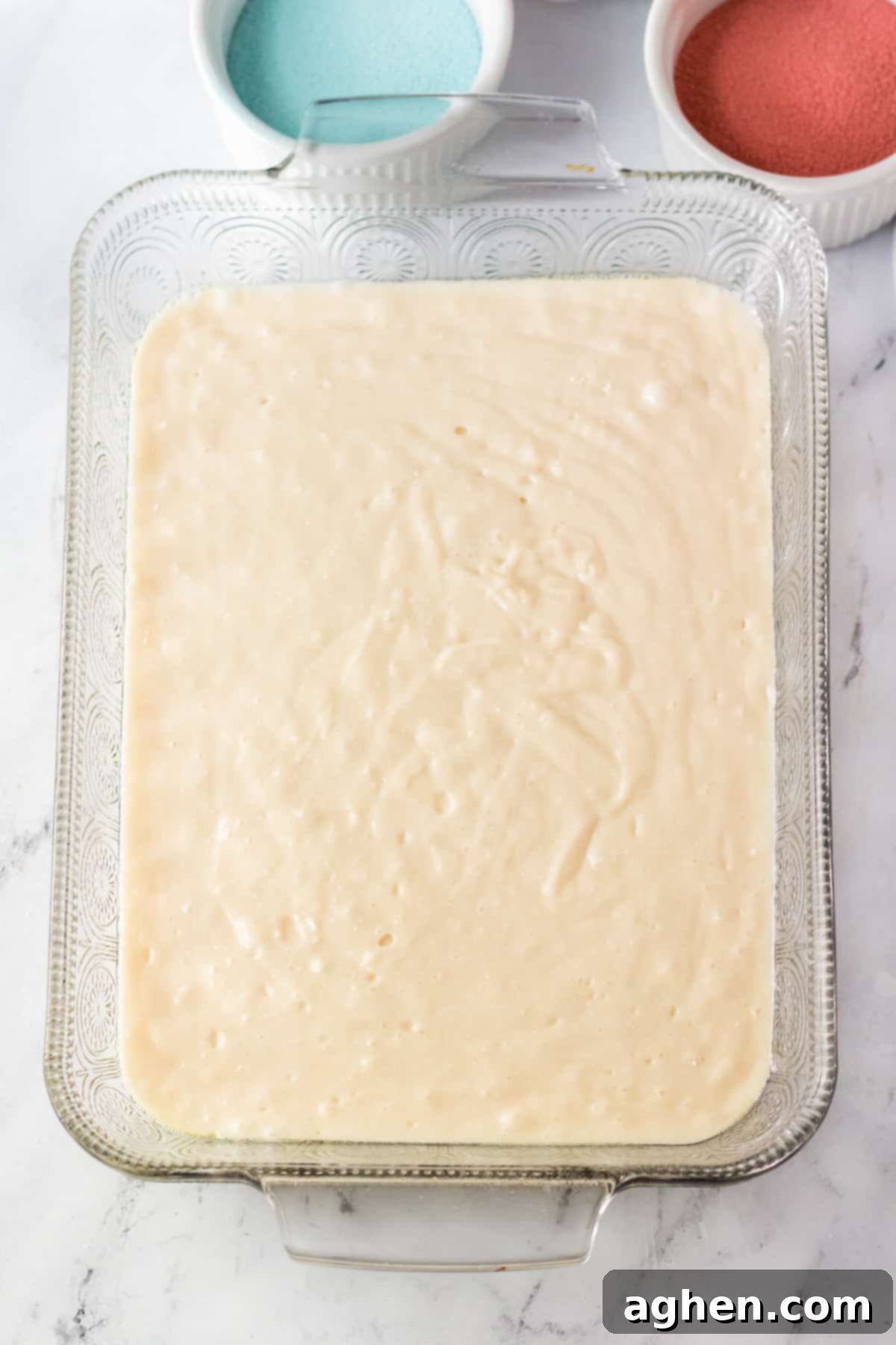White cake batter in 9 x 13 pan.