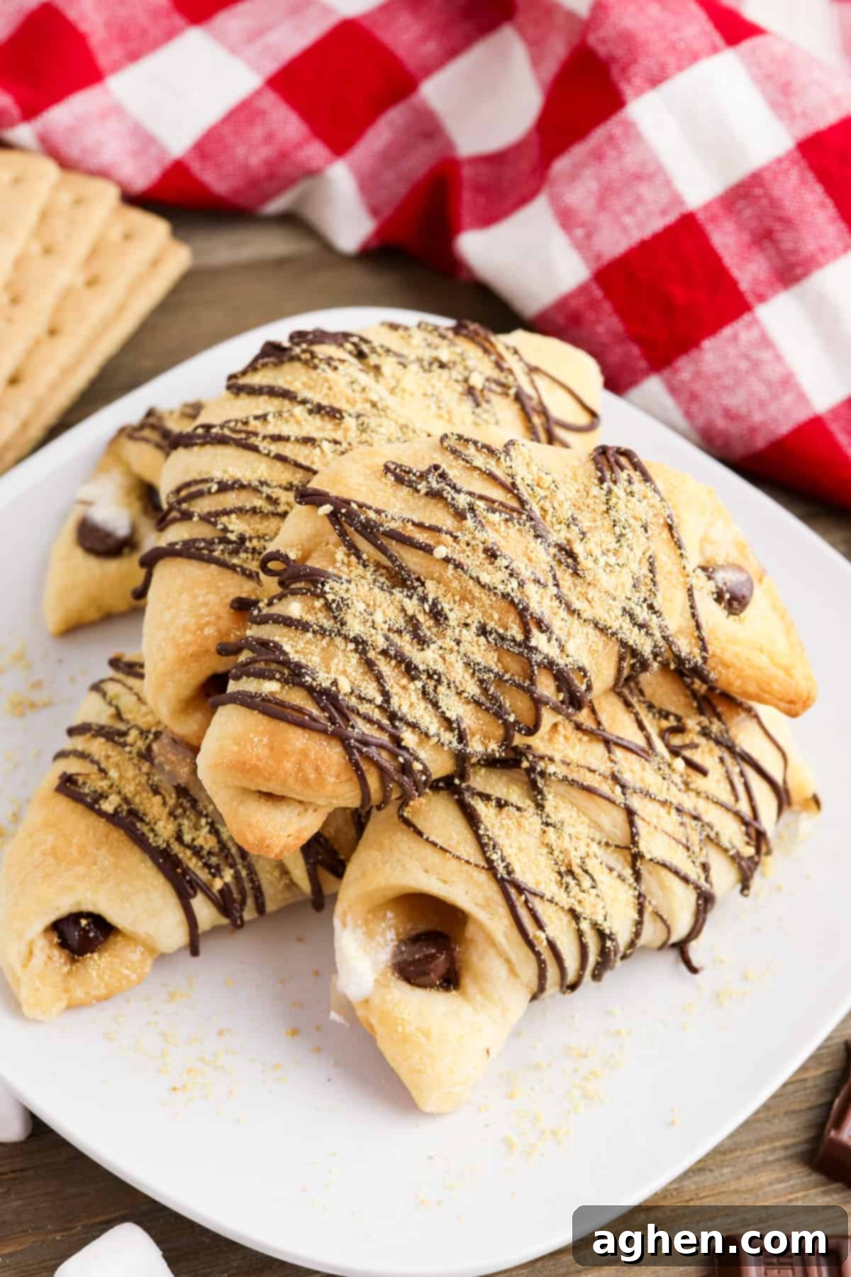S'mores crescent rolls with marshmallows, melted chocolate, and graham cracker crumbs.