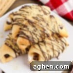 S'mores crescent rolls with marshmallows, melted chocolate, and graham cracker crumbs.