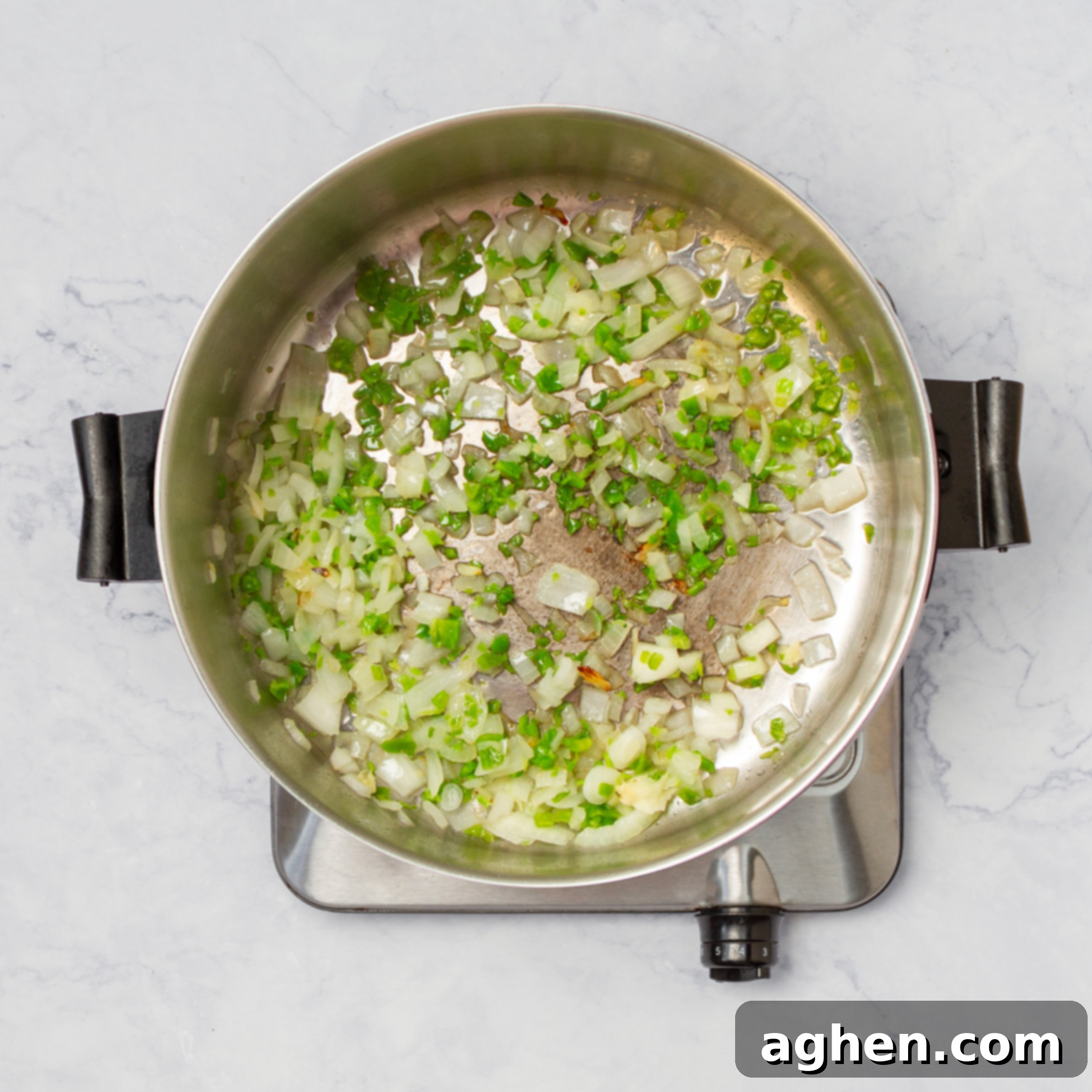 Caldo Tlalpeño: A Taste of Mexican Soul in Every Spoonful 4 Aromatics sautéing in a pan.
