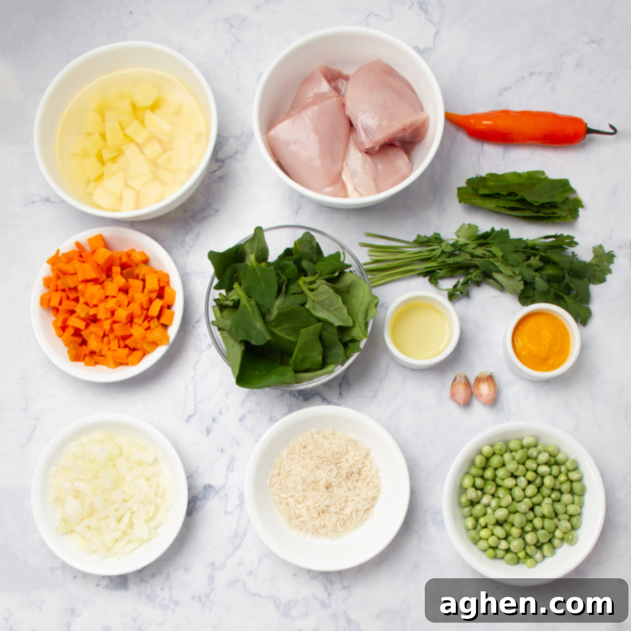 Aguadito de Pollo ingredients in separate dishes. 