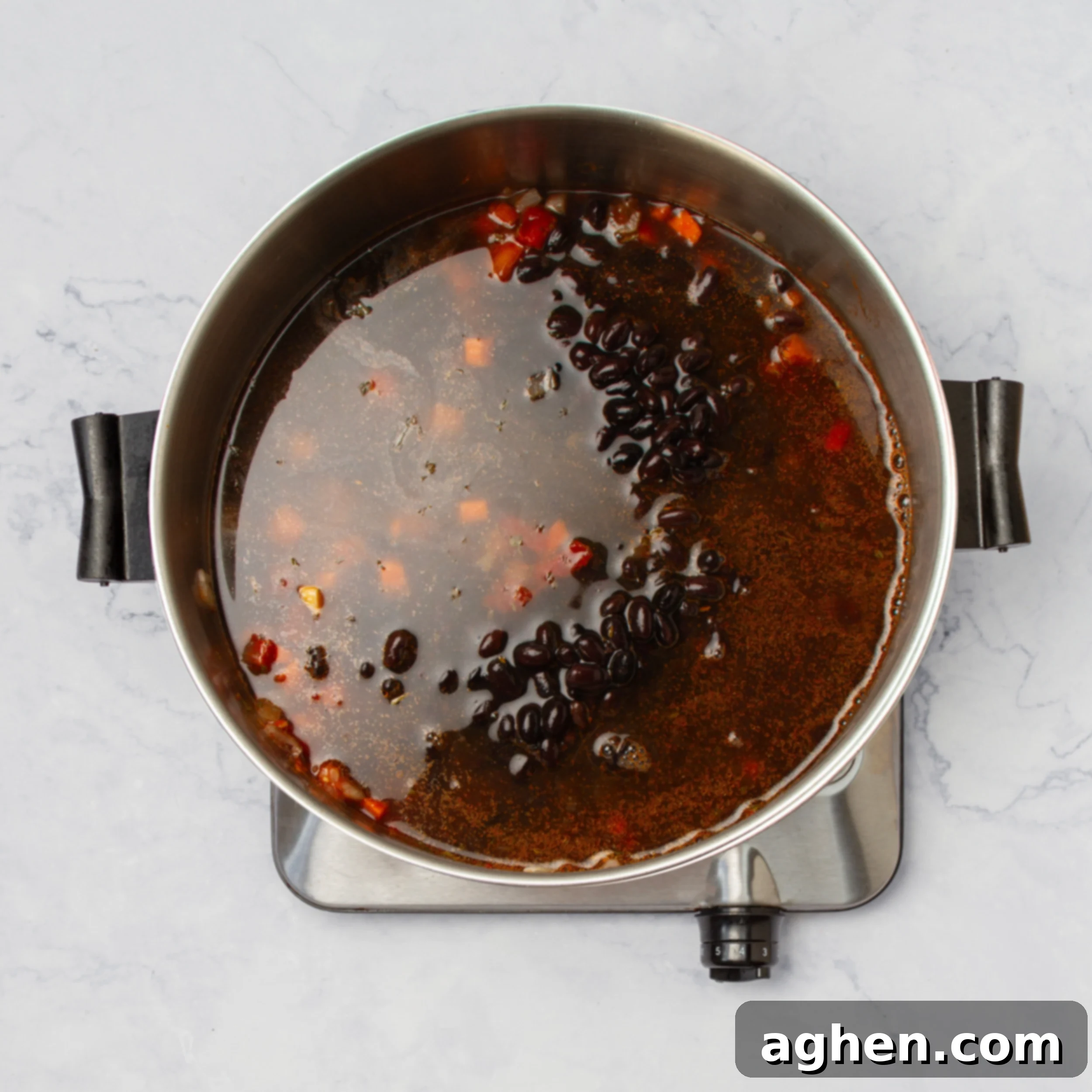 Authentic Cuban Black Bean Soup 6 All soup ingredients simmering in broth.