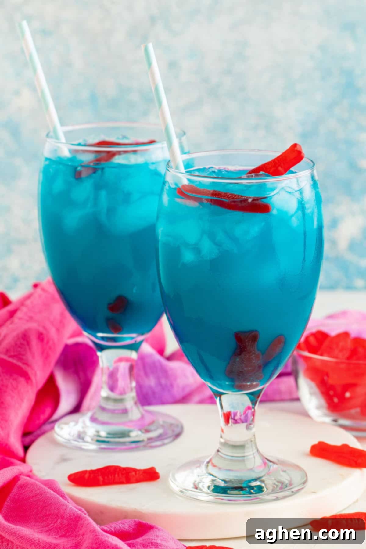 Two vibrant blue Ocean Water cocktails served in glasses, ready to be enjoyed.