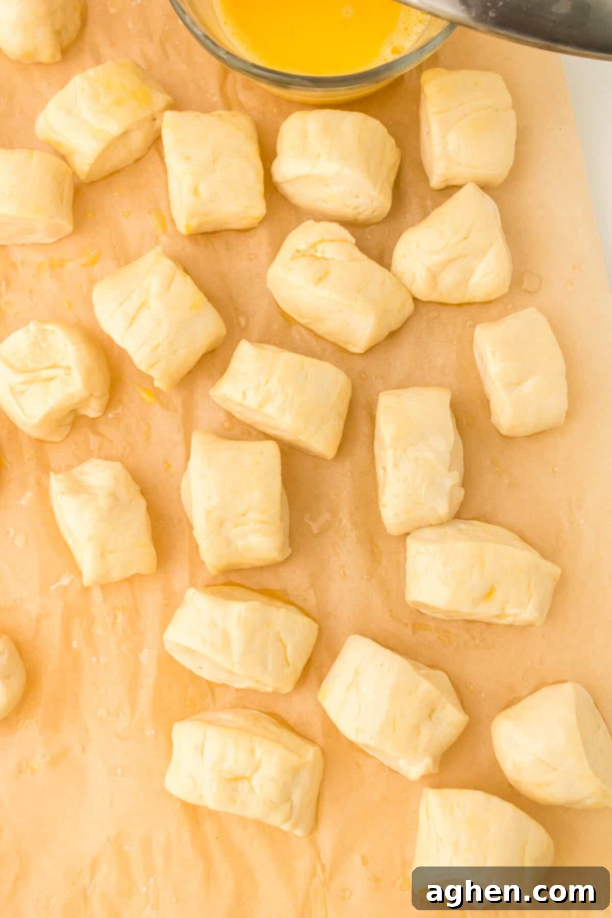 Pretzel dough brushed with egg wash. 