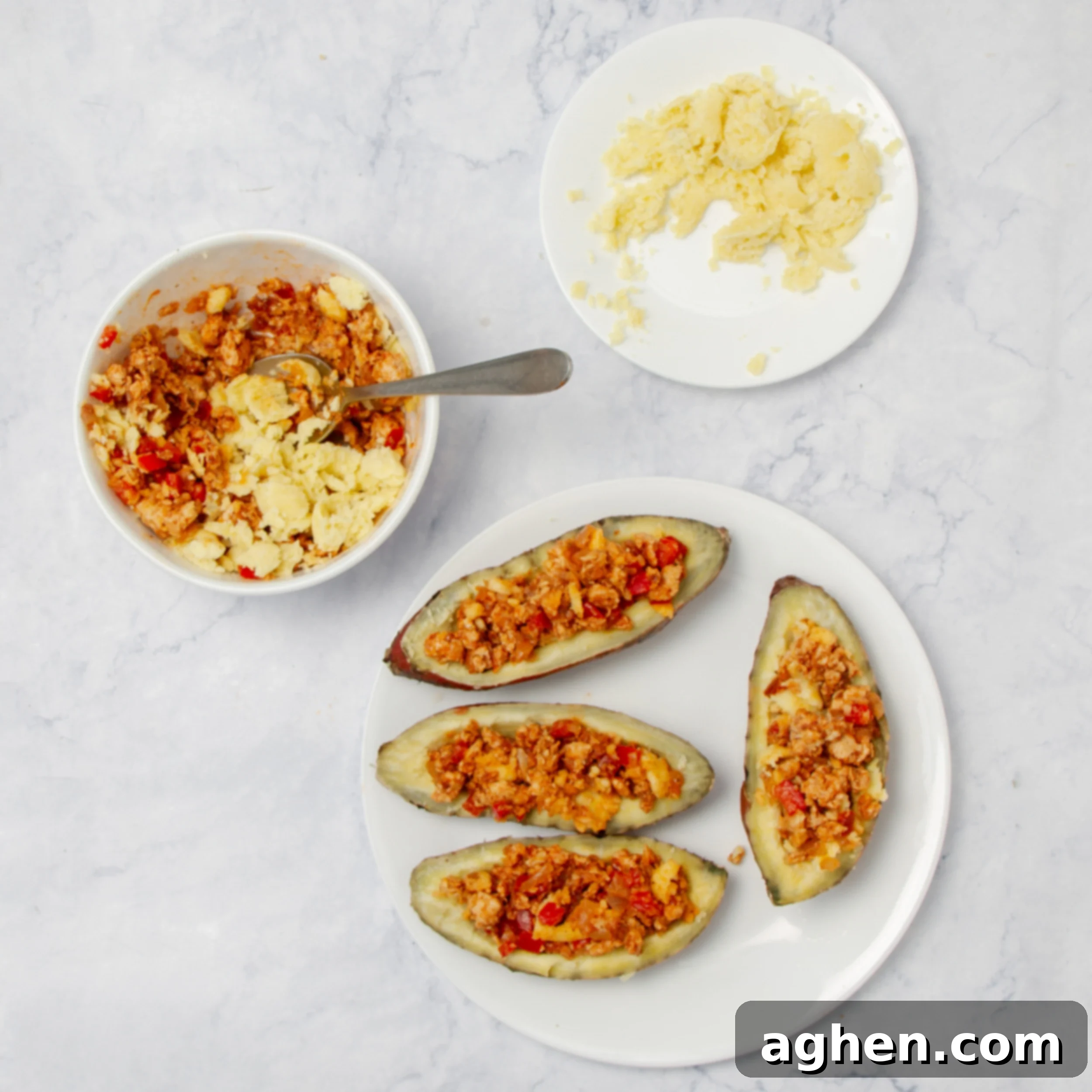 Baked potatoes with the center scooped out and sautéed filling being added. 