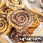 Cookies and Cream Dream Buns 17 Cookies and cream cinnamon rolls in lined pastry box.