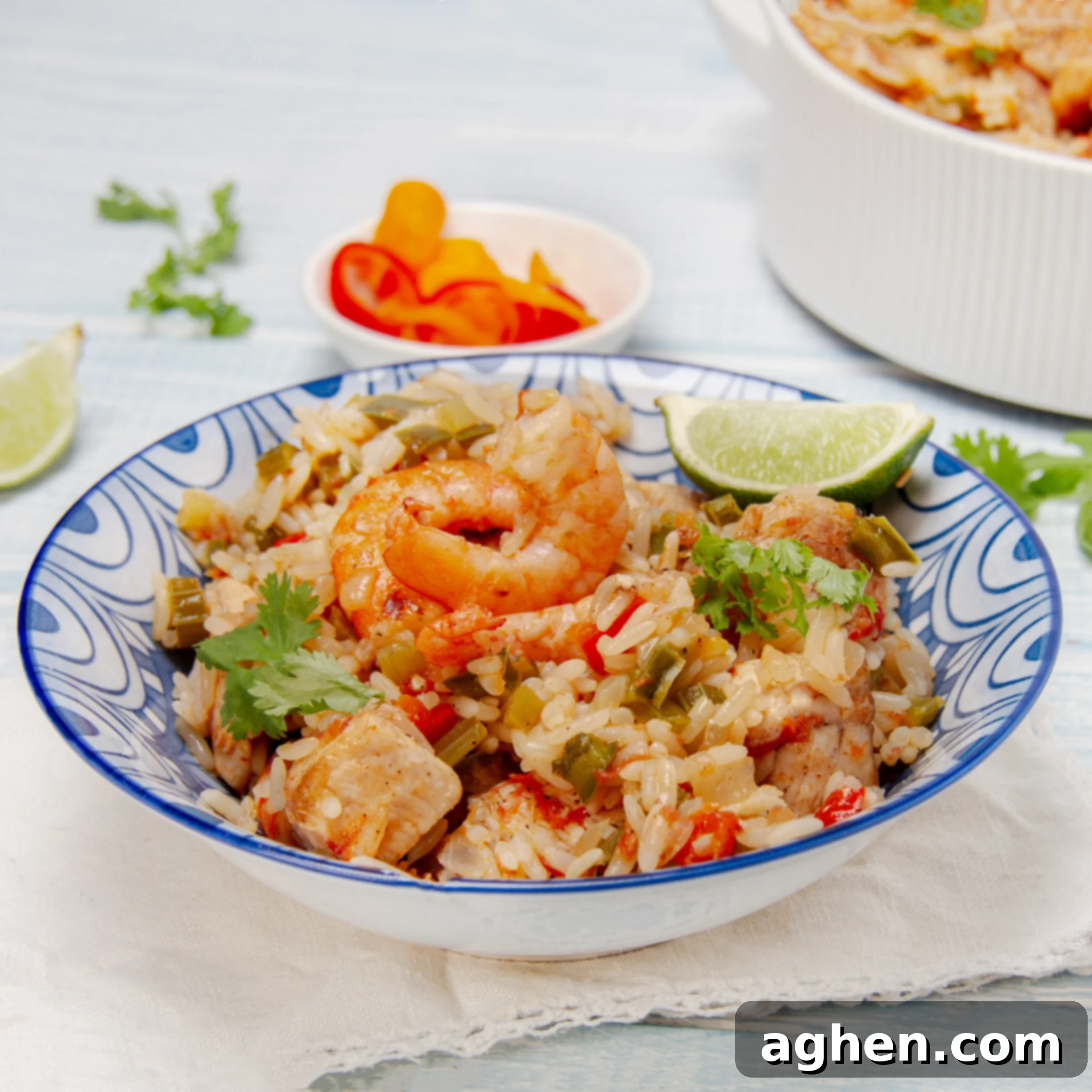 How to Make Weight Watchers Jambalaya 2 Lightened-up Jambalaya in a dish with a fresh lime wedge garnish, showing a colorful and hearty meal.