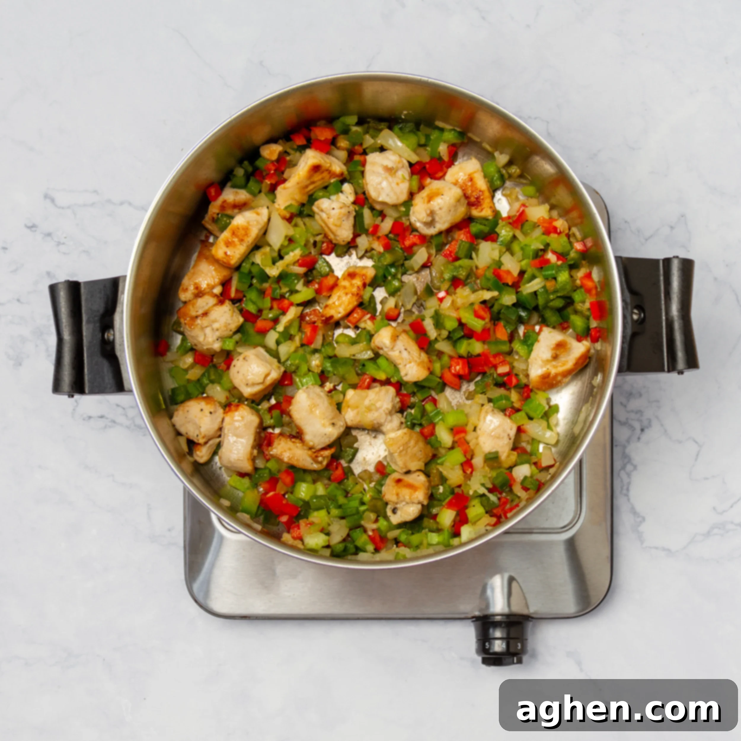 How to Make Weight Watchers Jambalaya 6 Cubed chicken breast added to the cooked vegetables in the pan, searing to a light brown.