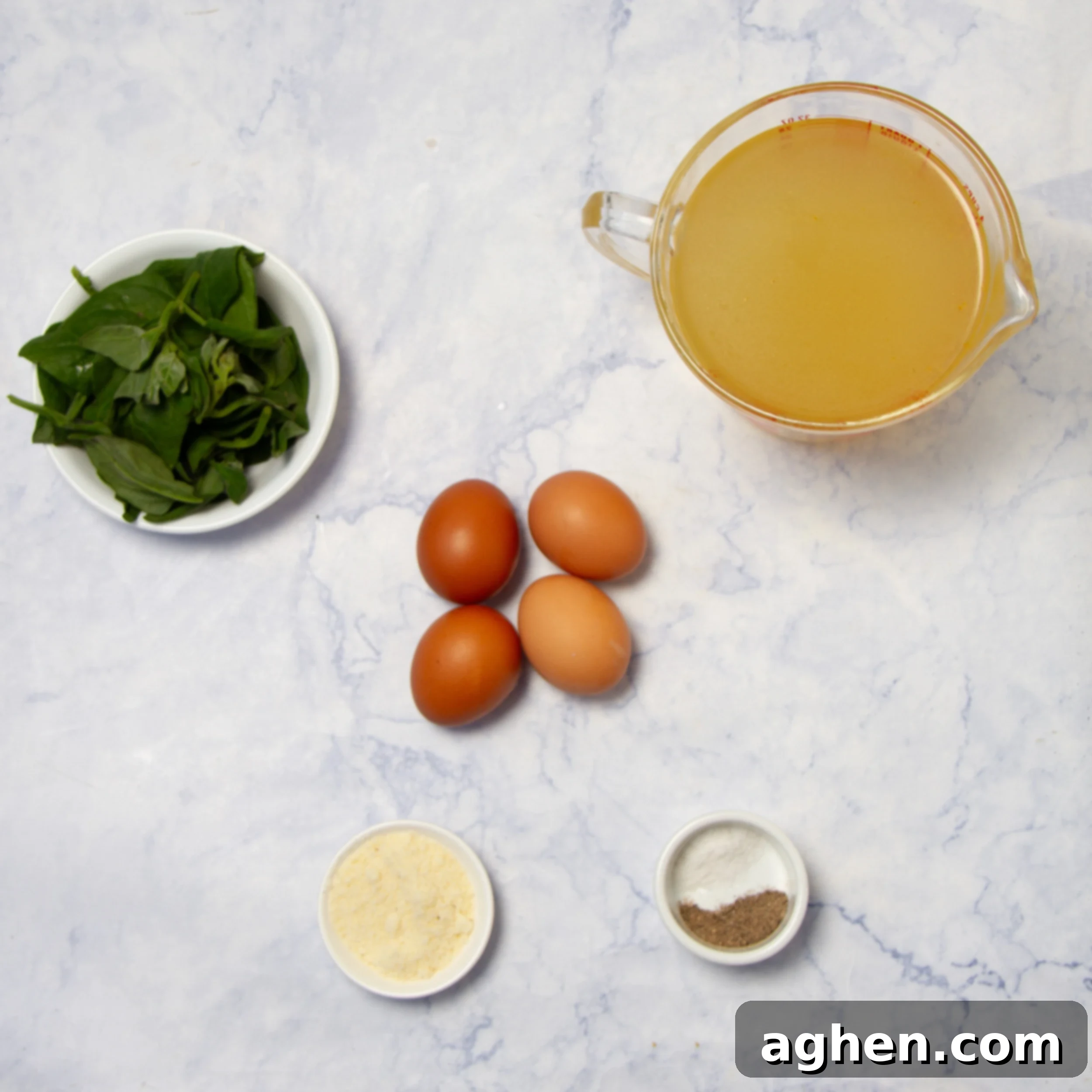 Classic Italian Stracciatella Soup 3 Stracciatella Soup ingredients in separate dishes on a counter.
