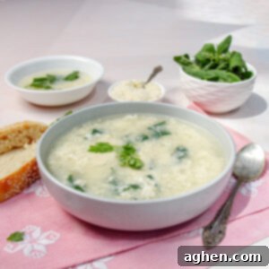 Classic Italian Stracciatella Soup 7 Creamy Italian Stracciatella Soup in a bowl with fresh basil and parmesan on the side.