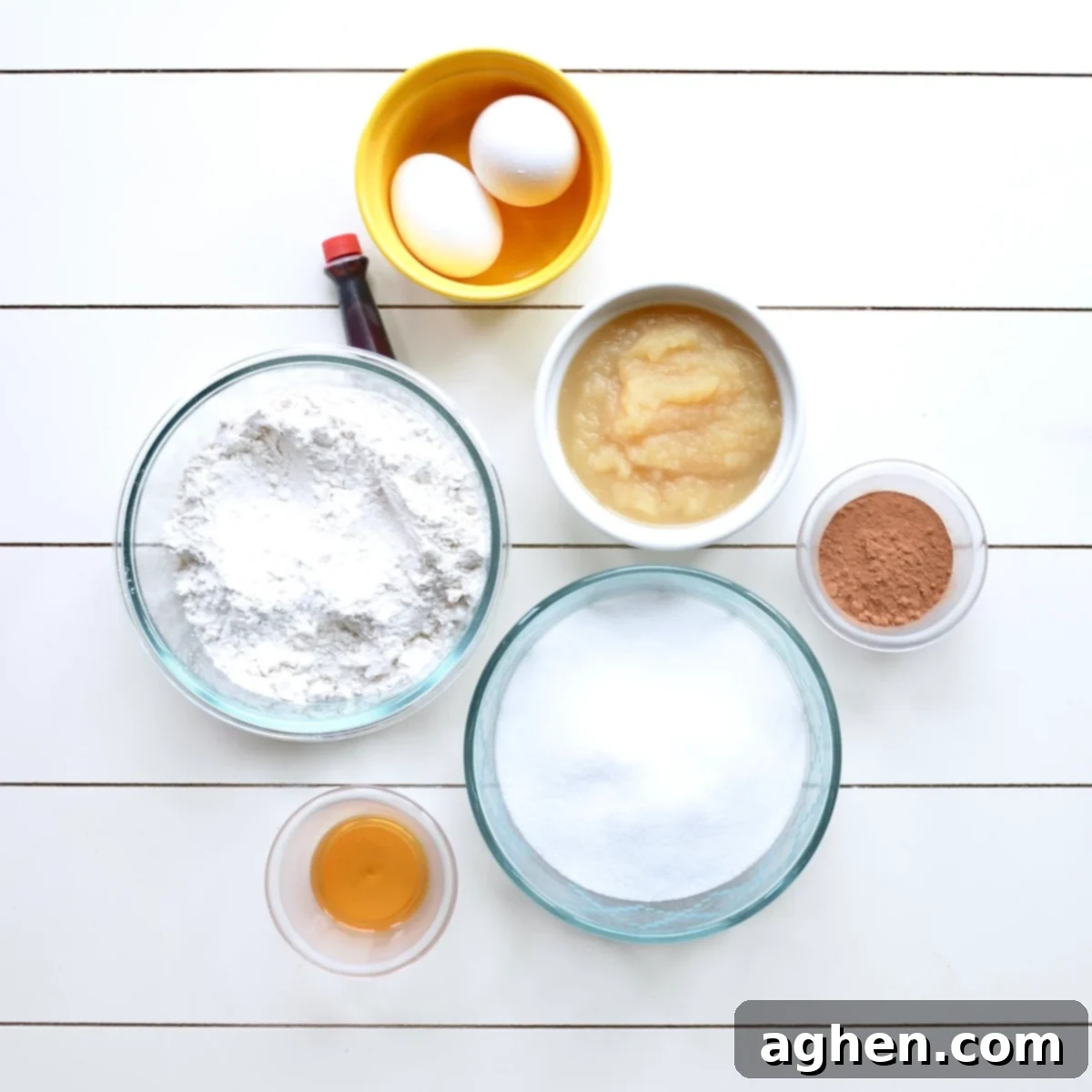 ingredients for making red velvet bars, including flour, cocoa, applesauce, and eggs