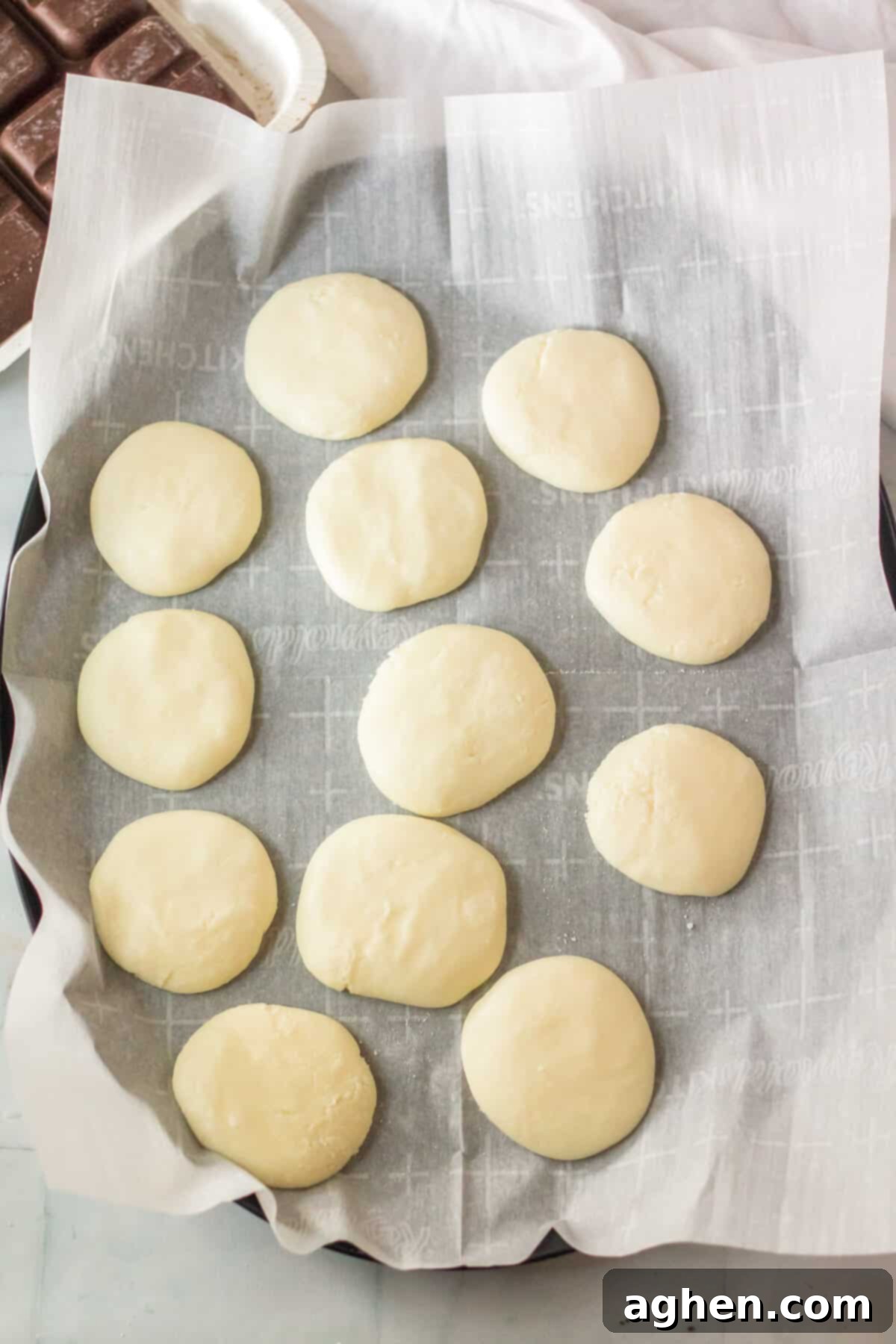 Easy Homemade Peppermint Patties 7 Pappermint patty filling shaped into discs and placed on lined pan.