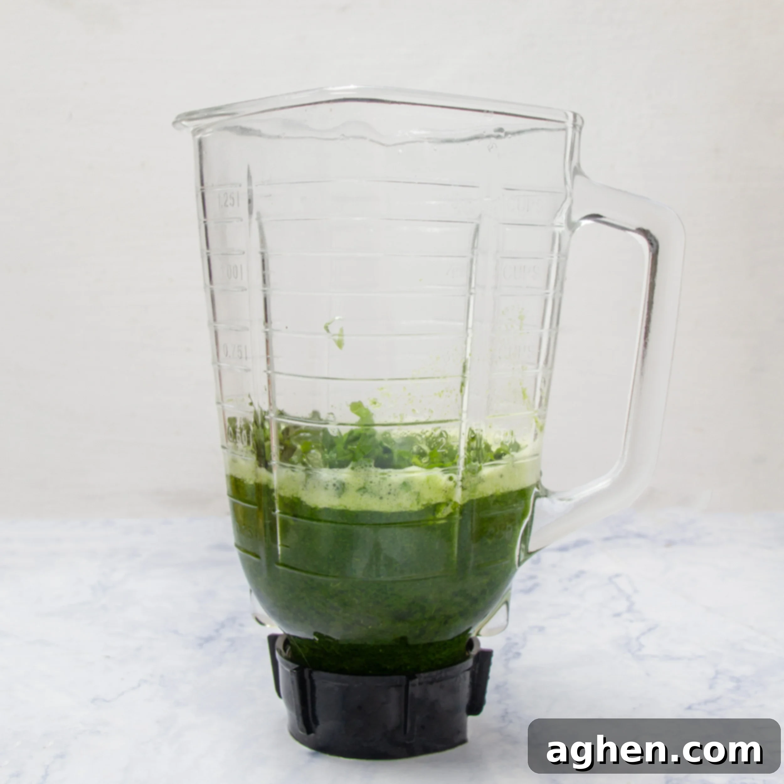 Cilantro and soup broth in a blender to be used as a cilantro garnish. 