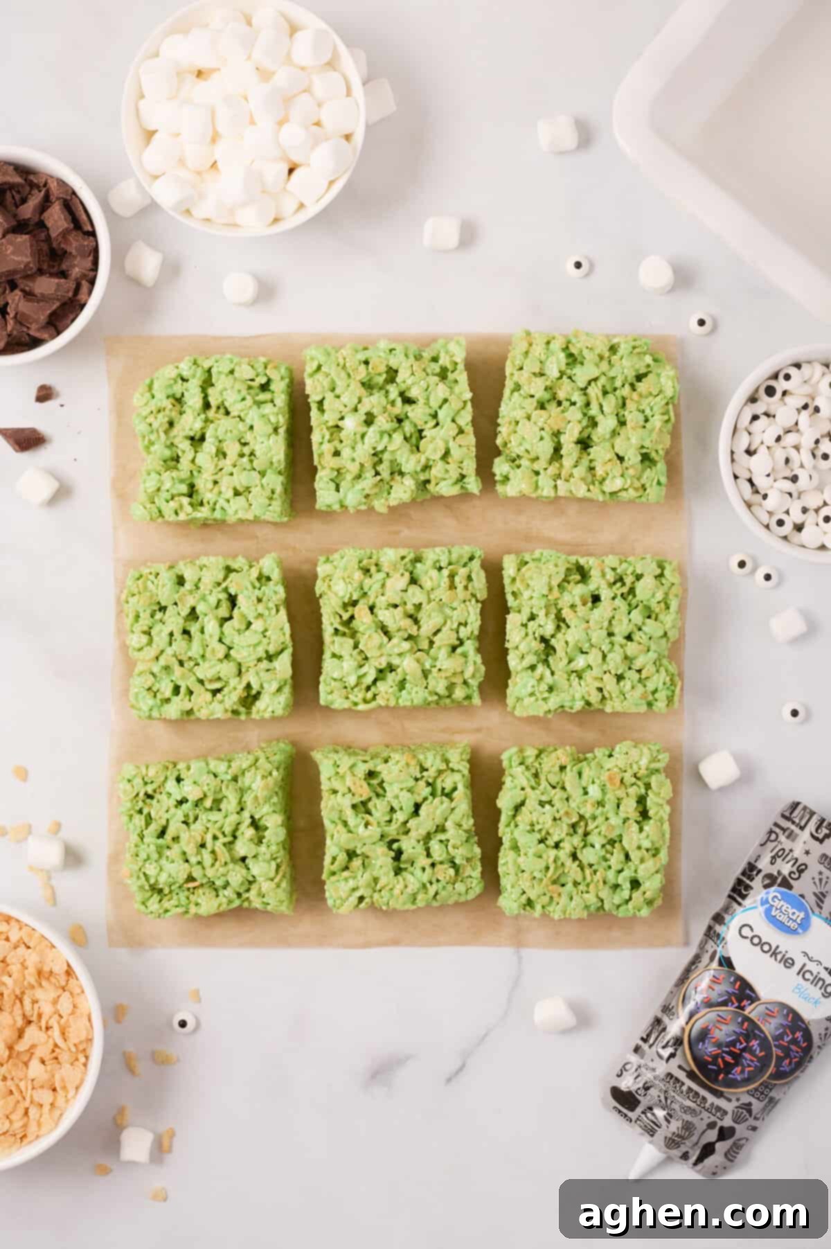 Green rice cereal treats cut into 9 equal squares.
