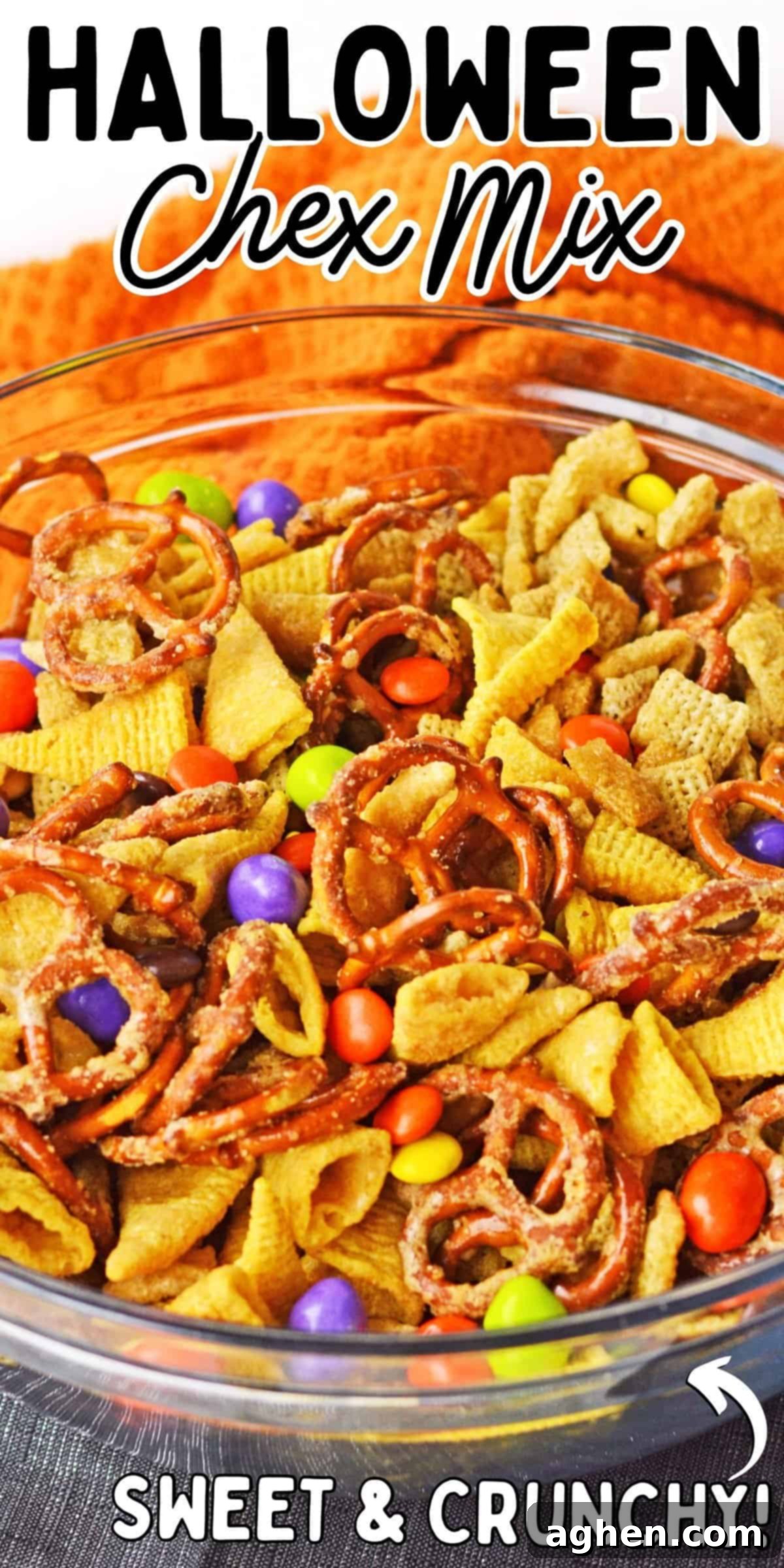 Halloween Chex Mix; Sweet and crunchy! A large, inviting image of the snack mix with various components clearly visible, suitable for sharing on social media like Pinterest.