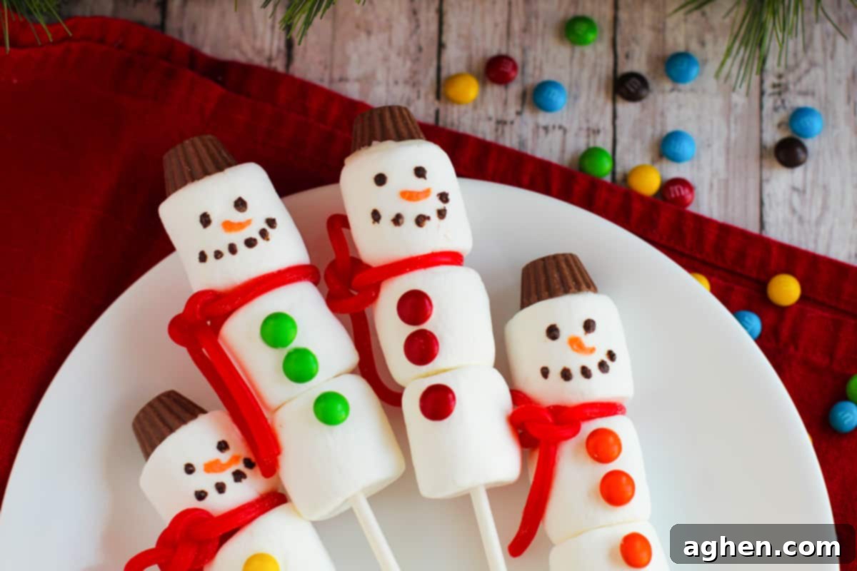 Snowman marshmallow treats on sticks.