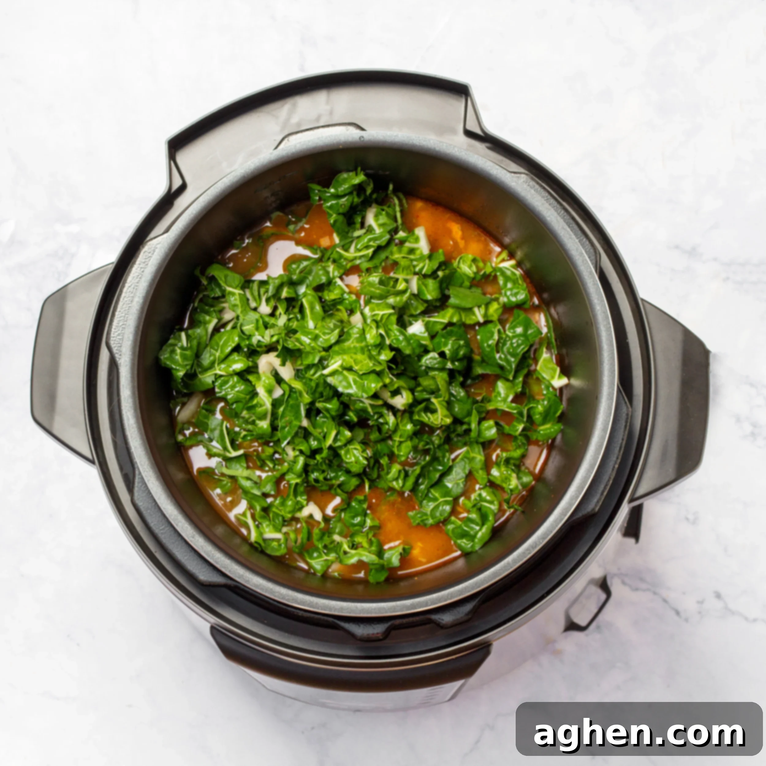 Minestrone's Spring Awakening: A Fresh Spin on the Classic 5 Leafy greens added to the soup after pressure cooking, highlighting the final fresh addition.