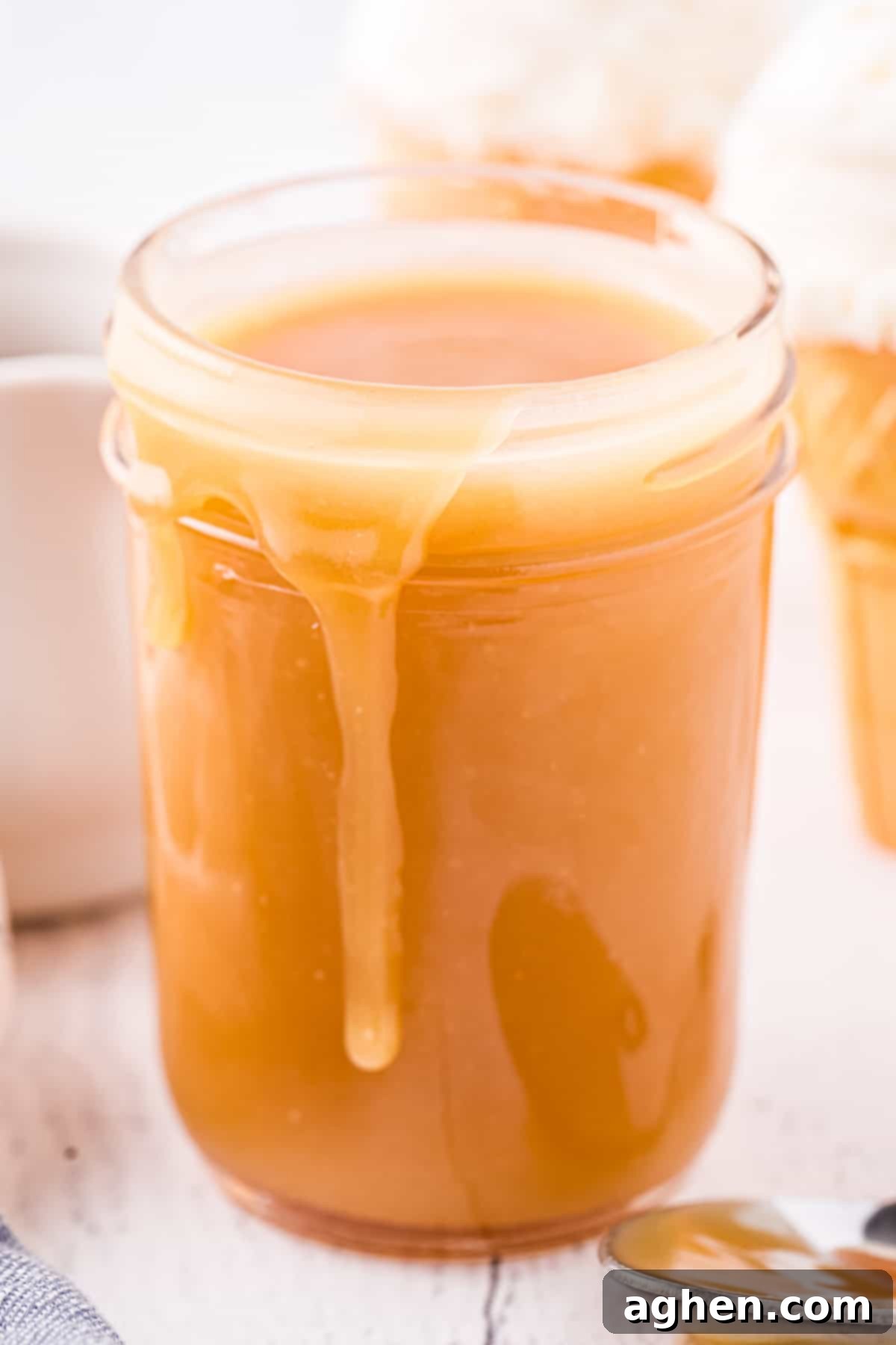 Perfect Homemade Caramel 8 Wide mouth mason jar full of homemade caramel sauce.