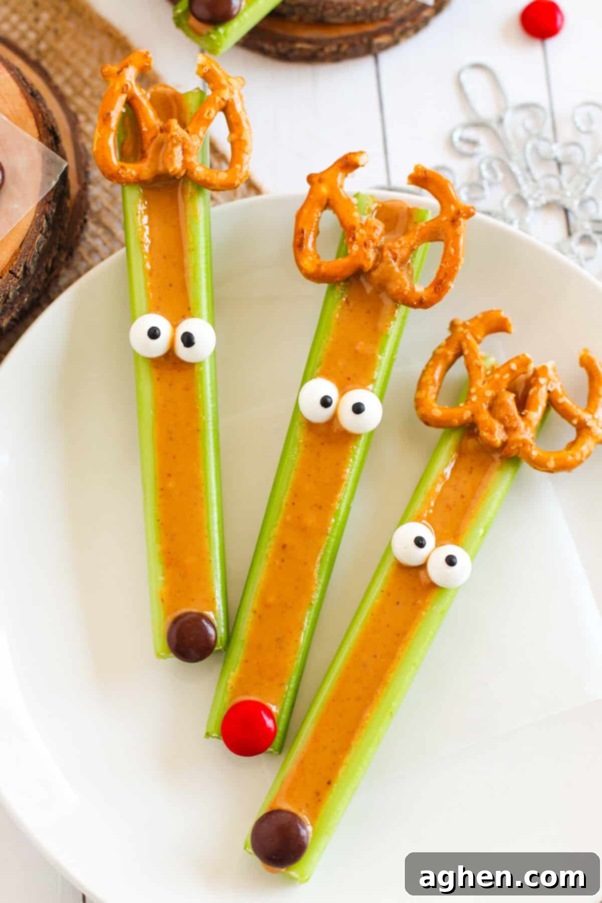 Festive Peanut Butter Antler Crunch 7 Three peanut butter celery sticks decorated to look like reindeer.