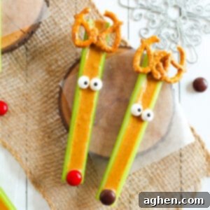 Festive Peanut Butter Antler Crunch 10 Celery reindeer decorated with pretzels, candy eyes, and M&Ms.